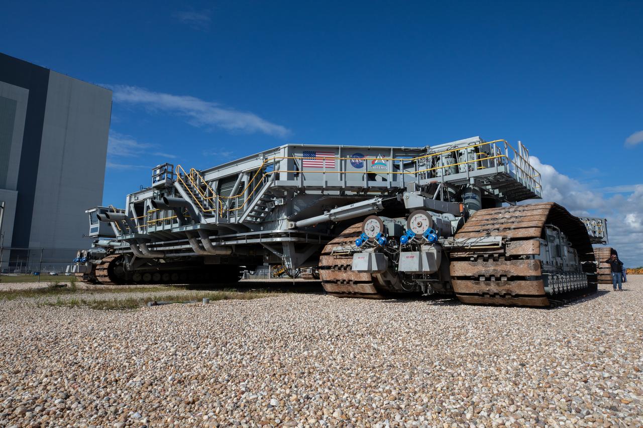 Engineers and technicians drive crawler-transporter 2 along the crawlerway toward the Vehicle Assembly Building (VAB) at NASA’s Kennedy Space Center in Florida on June 1, 2022. The crawler will go inside the VAB, where it will slide under the Artemis I Space Launch System with the Orion spacecraft atop on the mobile launcher and carry it to Launch Complex 39B for a wet dress rehearsal test ahead of the Artemis I launch. Artemis I will be the first integrated test of the SLS and Orion spacecraft. In later missions, NASA will land the first woman and the first person of color on the surface of the Moon, paving the way for a long-term lunar presence and serving as a steppingstone on the way to Mars. 