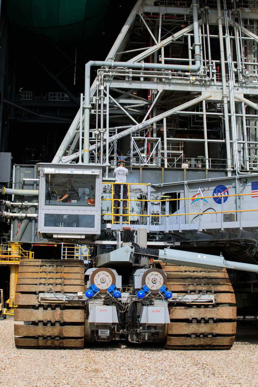 The crawler-transporter, driven by engineers, approaches the Vehicle Assembly Building (VAB) at NASA’s Kennedy Space Center in Florida on June 1, 2022. The crawler will go inside the VAB, where it will slide under the Artemis I Space Launch System with the Orion spacecraft atop on the mobile launcher and carry it to Launch Complex 39B for a wet dress rehearsal test ahead of the Artemis I launch. Artemis I will be the first integrated test of the SLS and Orion spacecraft. In later missions, NASA will land the first woman and the first person of color on the surface of the Moon, paving the way for a long-term lunar presence and serving as a steppingstone on the way to Mars. 