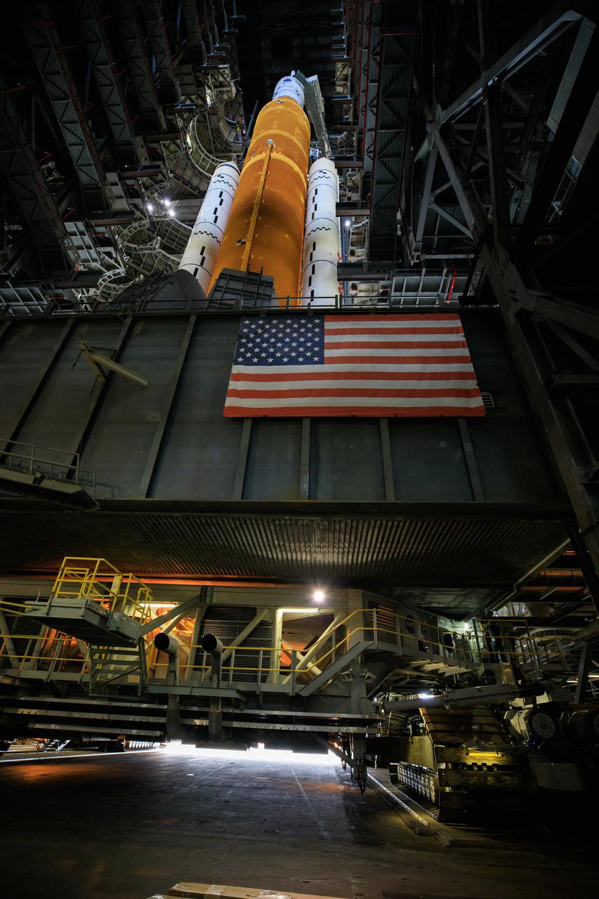 With all of the work platforms retracted, NASA’s Space Launch System and Orion spacecraft atop the mobile launcher are in view in High Bay 3 of the Vehicle Assembly Building at the agency’s Kennedy Space Center in Florida on June 3, 2022. The crawler-transporter, driven by engineers, will slide under the Artemis I stack atop the mobile launcher and carry it to Launch Complex 39B for a wet dress rehearsal test ahead of the Artemis I launch. Artemis I will be the first integrated test of the SLS and Orion spacecraft. In later missions, NASA will land the first woman and the first person of color on the surface of the Moon, paving the way for a long-term lunar presence and serving as a steppingstone on the way to Mars.