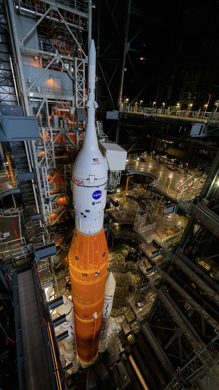 With all of the work platforms retracted, NASA’s Space Launch System and Orion spacecraft atop the mobile launcher are in view in High Bay 3 of the Vehicle Assembly Building at the agency’s Kennedy Space Center in Florida on June 3, 2022. The crawler-transporter, driven by engineers, will slide under the Artemis I stack atop the mobile launcher and carry it to Launch Complex 39B for a wet dress rehearsal test ahead of the Artemis I launch. Artemis I will be the first integrated test of the SLS and Orion spacecraft. In later missions, NASA will land the first woman and the first person of color on the surface of the Moon, paving the way for a long-term lunar presence and serving as a steppingstone on the way to Mars.