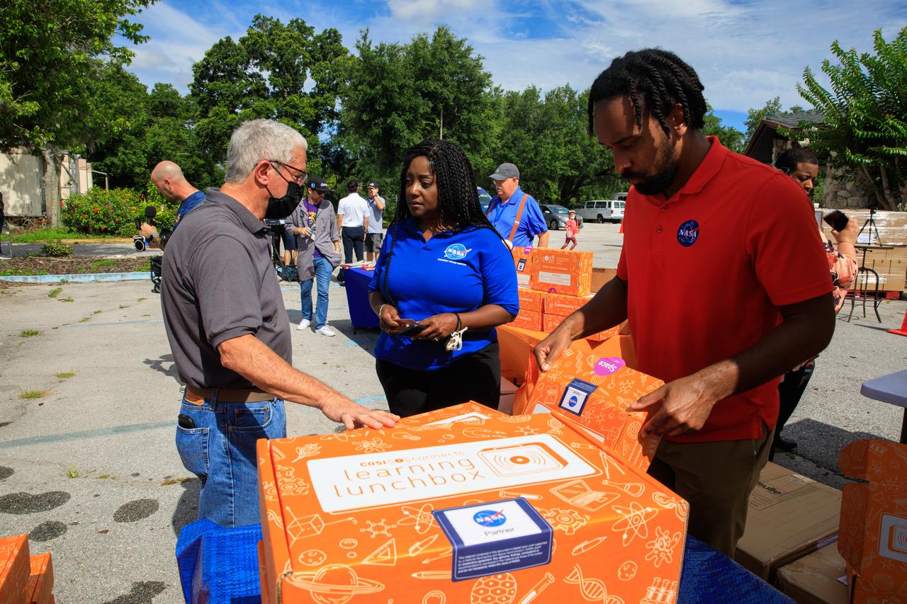 Barbara Brown (center), director of the Exploration Research and Technology Program at Kennedy Space Center in Florida, helped kick off a new initiative to deliver food and hands-on science, technology, engineering, and math kits, called Learning Lunchboxes, at New Beginnings Church – The Gathering Place in Orlando, Florida on Friday, June 3. The lunchboxes are aimed at inspiring and educating youth and families about NASA’s upcoming Artemis missions, which includes landing the first woman and person of color on the Moon and helping prepare for human exploration of Mars. Partners on the initiative with NASA include the Center of Science and Industry, the Second Harvest Food Bank, and the Orlando Science Center. The NASA Artemis Learning Lunchbox is made possible through NASA’s Teams Engaging Affiliated Museums and Informal Institutions (TEAM II) program. NASA Learning Lunchboxes provide five space-focused learning activities that showcase the diversity of STEM at NASA. COSI will distribute 30,000 NASA Learning Lunchboxes at local food banks across the country to help feed hungry lives and feed hungry minds. This innovative, community-based model will bring together other science centers and museums, afterschool providers, and community leaders to highlight the importance of STEM. This project also includes digital extension resources.