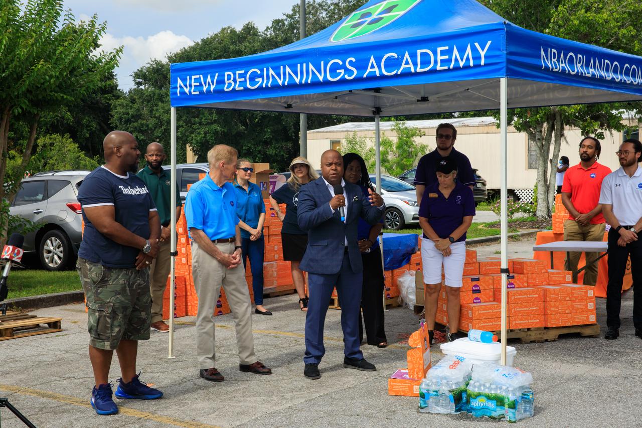 Dr. Frederic Bertley (center), president and CEO, Center of Science and Industry (COSI), speaks at New Beginnings Church – The Gathering Place in Orlando, Florida on Friday, June 3, as part of the launch of a new initiative to deliver food and hands-on science, technology, engineering, and math kits, called Learning Lunchboxes. NASA Administrator Bill Nelson and other agency representatives were on hand to hand out the lunchboxes, which are aimed at inspiring and educating youth and families about NASA’s upcoming Artemis missions, including landing the first woman and person of color on the Moon and helping prepare for human exploration of Mars. Along with COSI, NASA’s partners on the initiative include the Second Harvest Food Bank and the Orlando Science Center. The NASA Artemis Learning Lunchbox is made possible through NASA’s Teams Engaging Affiliated Museums and Informal Institutions (TEAM II) program. NASA Learning Lunchboxes provide five space-focused learning activities that showcase the diversity of STEM at NASA. COSI will distribute 30,000 NASA Learning Lunchboxes at local food banks across the country to help feed hungry lives and feed hungry minds. This innovative, community-based model will bring together other science centers and museums, afterschool providers, and community leaders to highlight the importance of STEM. This project also includes digital extension resources.