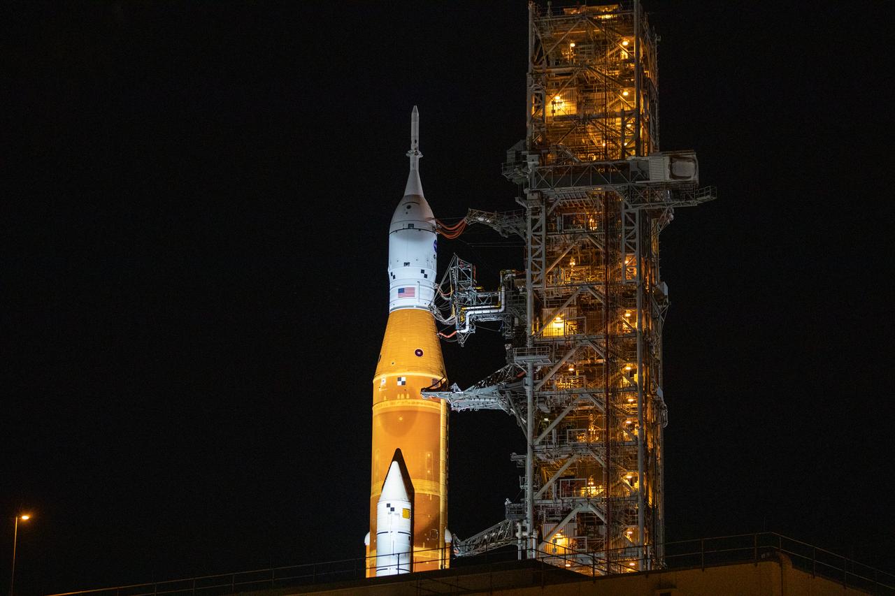 Seen here is a close-up view of the Orion spacecraft atop the Space Launch System (SLS) rocket as it rolls to Launch Complex 39B at NASA’s Kennedy Space Center in Florida on June 6, 2022. Carried by the 6.65-million-pound crawler-transporter 2, the rocket is traveling to the launch pad for NASA’s next wet dress rehearsal attempt ahead of the Artemis I launch. The first in an increasingly complex series of missions, Artemis I will test SLS and Orion as an integrated system prior to crewed flights to the Moon. Through Artemis, NASA will land the first woman and first person of color on the lunar surface, paving the way for a long-term lunar presence and using the Moon as a steppingstone before venturing to Mars.