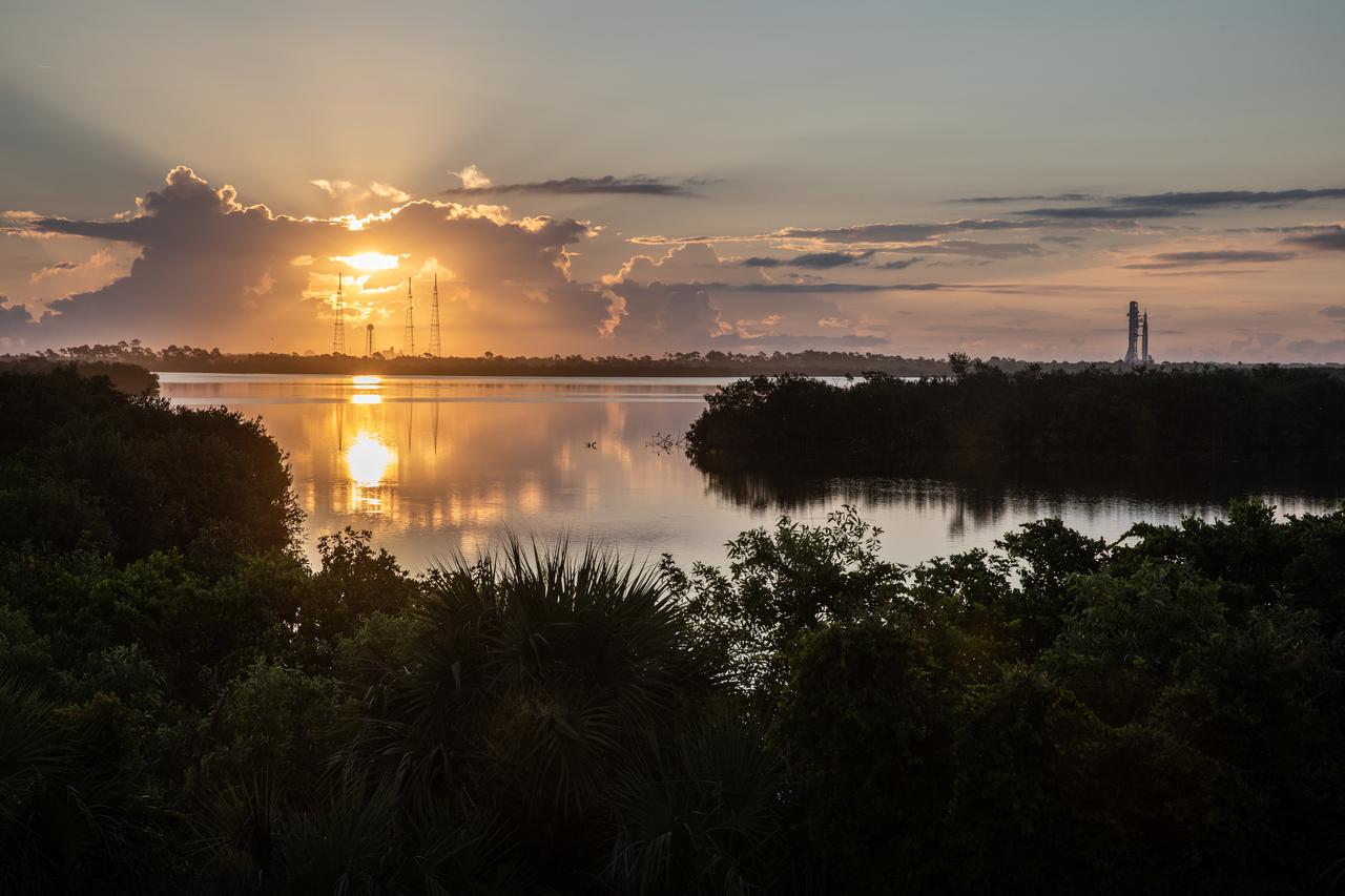 As the Sun rises, NASA’s Artemis I Moon rocket – carried atop the crawler-transporter 2 – approaches Launch Complex 39B at NASA’s Kennedy Space Center in Florida on June 6, 2022. The rocket rolled out of the Vehicle Assembly Building in the early morning hours to travel the 4.2 miles to the launch pad for NASA’s next wet dress rehearsal attempt ahead of the Artemis I launch. The first in an increasingly complex series of missions, Artemis I will test the Space Launch System rocket and Orion spacecraft as an integrated system prior to crewed flights to the Moon. Through Artemis, NASA will land the first woman and first person of color on the lunar surface, paving the way for a long-term lunar presence and using the Moon as a steppingstone before venturing to Mars.