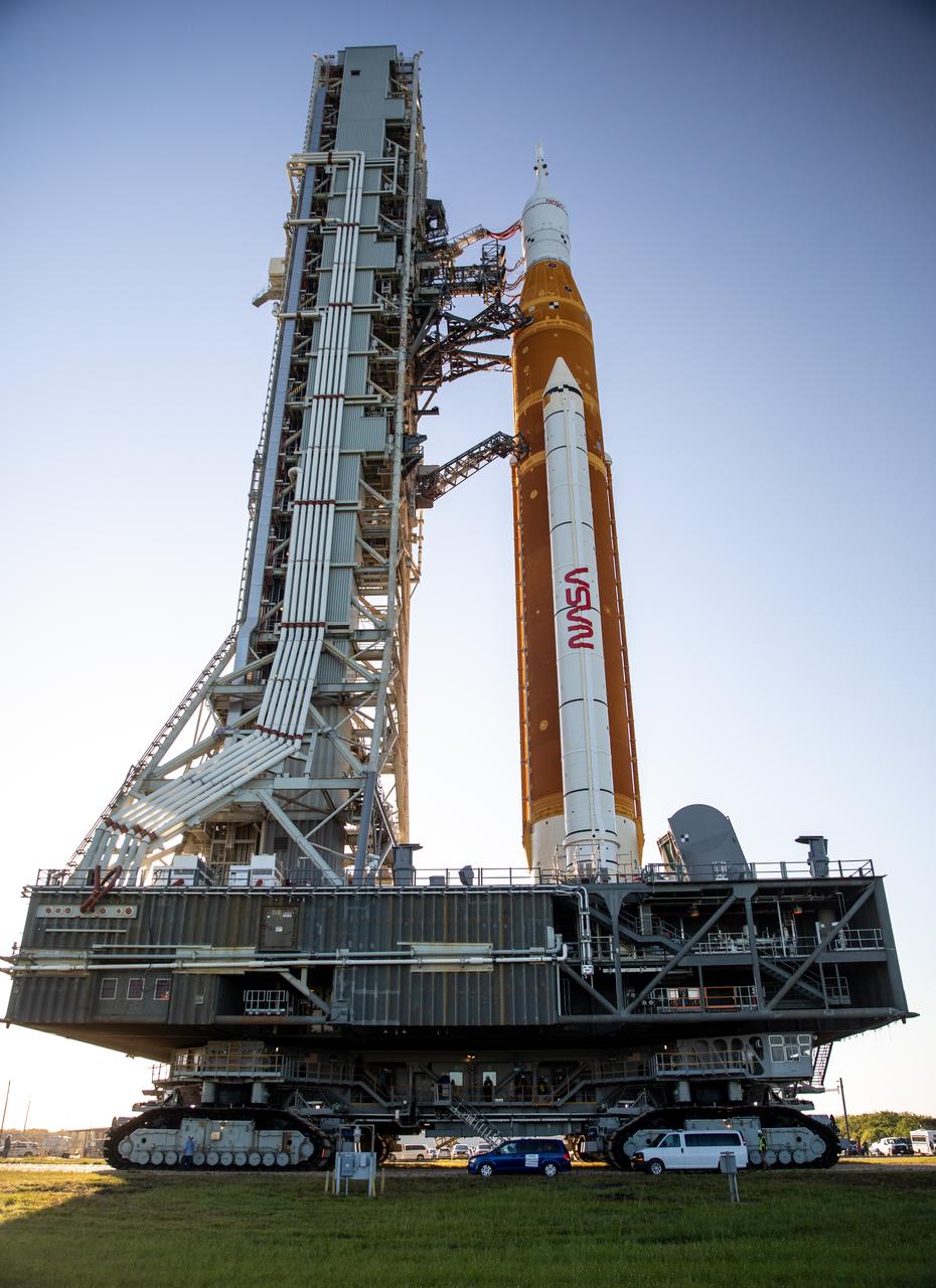 In this view looking up, NASA’s crawler-transporter 2 can be seen bearing the weight of the agency’s Artemis I Moon rocket and mobile launcher as it carries the duo to Kennedy Space Center’s Launch Complex 39B in Florida on June 6, 2022. The rocket rolled out of the Vehicle Assembly Building in the early morning hours to travel the 4.2 miles to the launch pad for NASA’s next wet dress rehearsal attempt ahead of the Artemis I launch. The first in an increasingly complex series of missions, Artemis I will test the Space Launch System rocket and Orion spacecraft as an integrated system prior to crewed flights to the Moon. Through Artemis, NASA will land the first woman and first person of color on the lunar surface, paving the way for a long-term lunar presence and using the Moon as a steppingstone before venturing to Mars.
