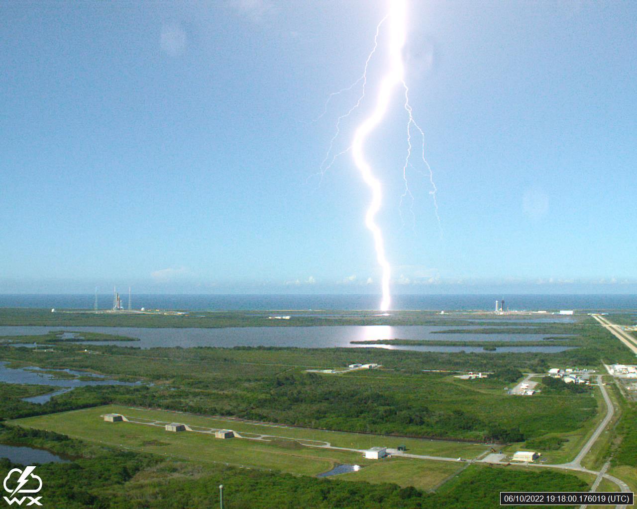 A lightning strike was recorded at Launch Complex 39B at NASA’s Kennedy Space Center in Florida on June 10, 2022. NASA’s Space Launch System (SLS) and Orion spacecraft atop the mobile launcher are on the launch pad in preparation for the Artemis I mission. The lightning strike was recorded by cameras stationed at the pad and mobile launcher using a special filter called a “clear day frame,” which provides an overlay of the raw frame on a reference image. Artemis I will be the first integrated test of the SLS and Orion spacecraft. In later missions, NASA will land the first woman and the first woman of color on the surface of the Moon, paving the way for a long-term lunar presence and serving as a steppingstone on the way to Mars. 
