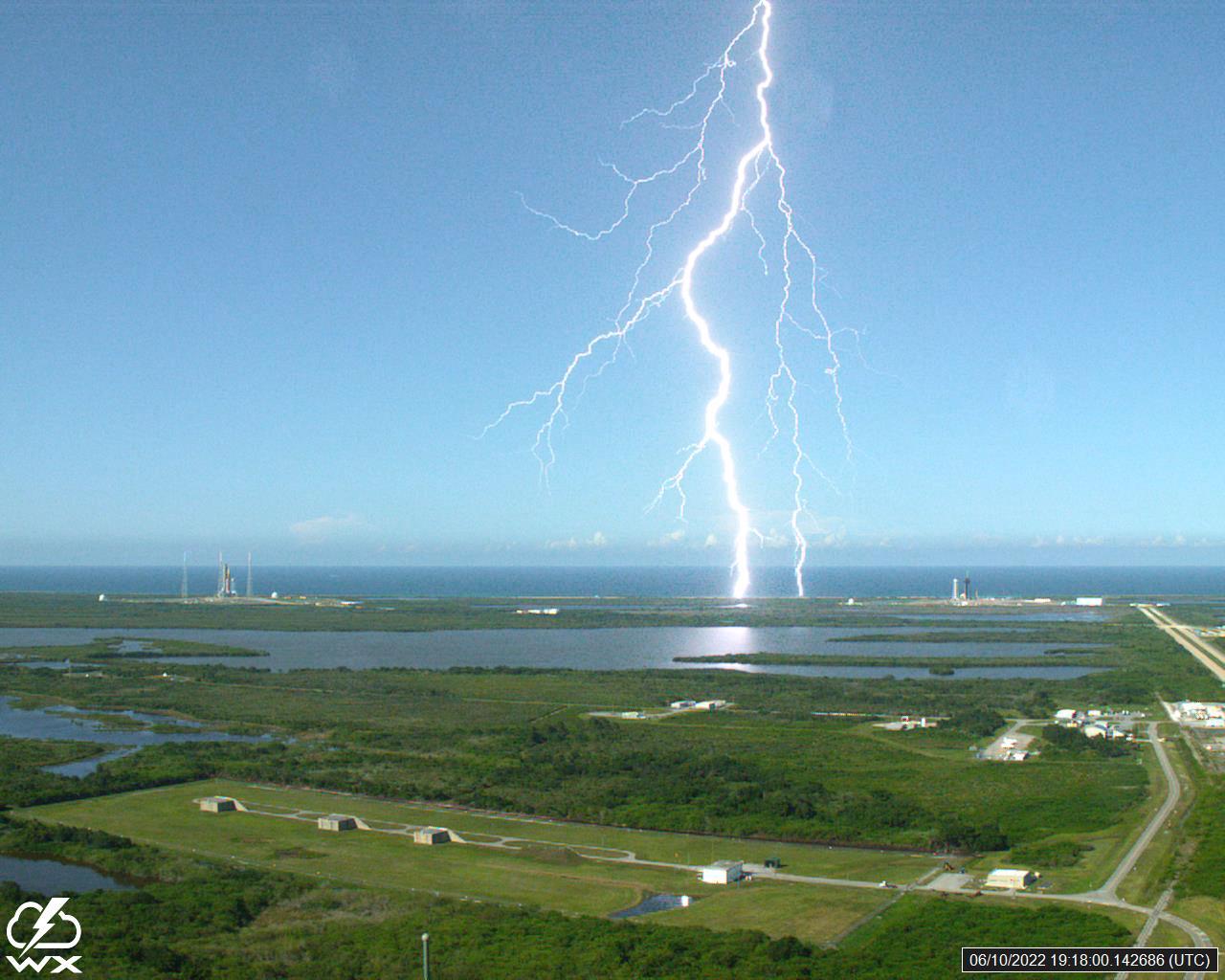A lightning strike was recorded at Launch Complex 39B at NASA’s Kennedy Space Center in Florida on June 10, 2022. NASA’s Space Launch System (SLS) and Orion spacecraft atop the mobile launcher are on the launch pad in preparation for the Artemis I mission. The lightning strike was recorded by cameras stationed at the pad and mobile launcher using a special filter called a “clear day frame,” which provides an overlay of the raw frame on a reference image. Artemis I will be the first integrated test of the SLS and Orion spacecraft. In later missions, NASA will land the first woman and the first woman of color on the surface of the Moon, paving the way for a long-term lunar presence and serving as a steppingstone on the way to Mars. 