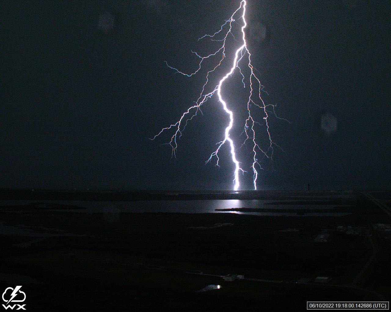 A lightning strike was recorded at Launch Complex 39B at NASA’s Kennedy Space Center in Florida on June 10, 2022. NASA’s Space Launch System (SLS) and Orion spacecraft atop the mobile launcher are on the launch pad in preparation for the Artemis I mission. The lightning strike was recorded by cameras stationed at the pad and mobile launcher using a special filter called a “clear day frame,” which provides an overlay of the raw frame on a reference image. Artemis I will be the first integrated test of the SLS and Orion spacecraft. In later missions, NASA will land the first woman and the first woman of color on the surface of the Moon, paving the way for a long-term lunar presence and serving as a steppingstone on the way to Mars. 