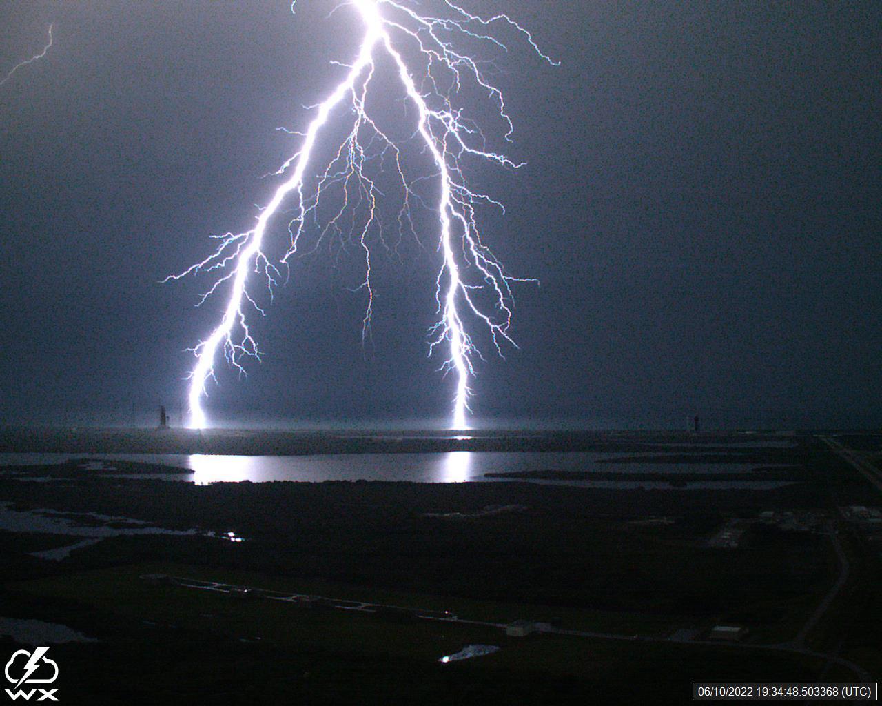 A lightning strike was recorded at Launch Complex 39B at NASA’s Kennedy Space Center in Florida on June 10, 2022. NASA’s Space Launch System (SLS) and Orion spacecraft atop the mobile launcher are on the launch pad in preparation for the Artemis I mission. The lightning strike was recorded by cameras stationed at the pad and mobile launcher using a special filter called a “clear day frame,” which provides an overlay of the raw frame on a reference image. Artemis I will be the first integrated test of the SLS and Orion spacecraft. In later missions, NASA will land the first woman and the first woman of color on the surface of the Moon, paving the way for a long-term lunar presence and serving as a steppingstone on the way to Mars. 