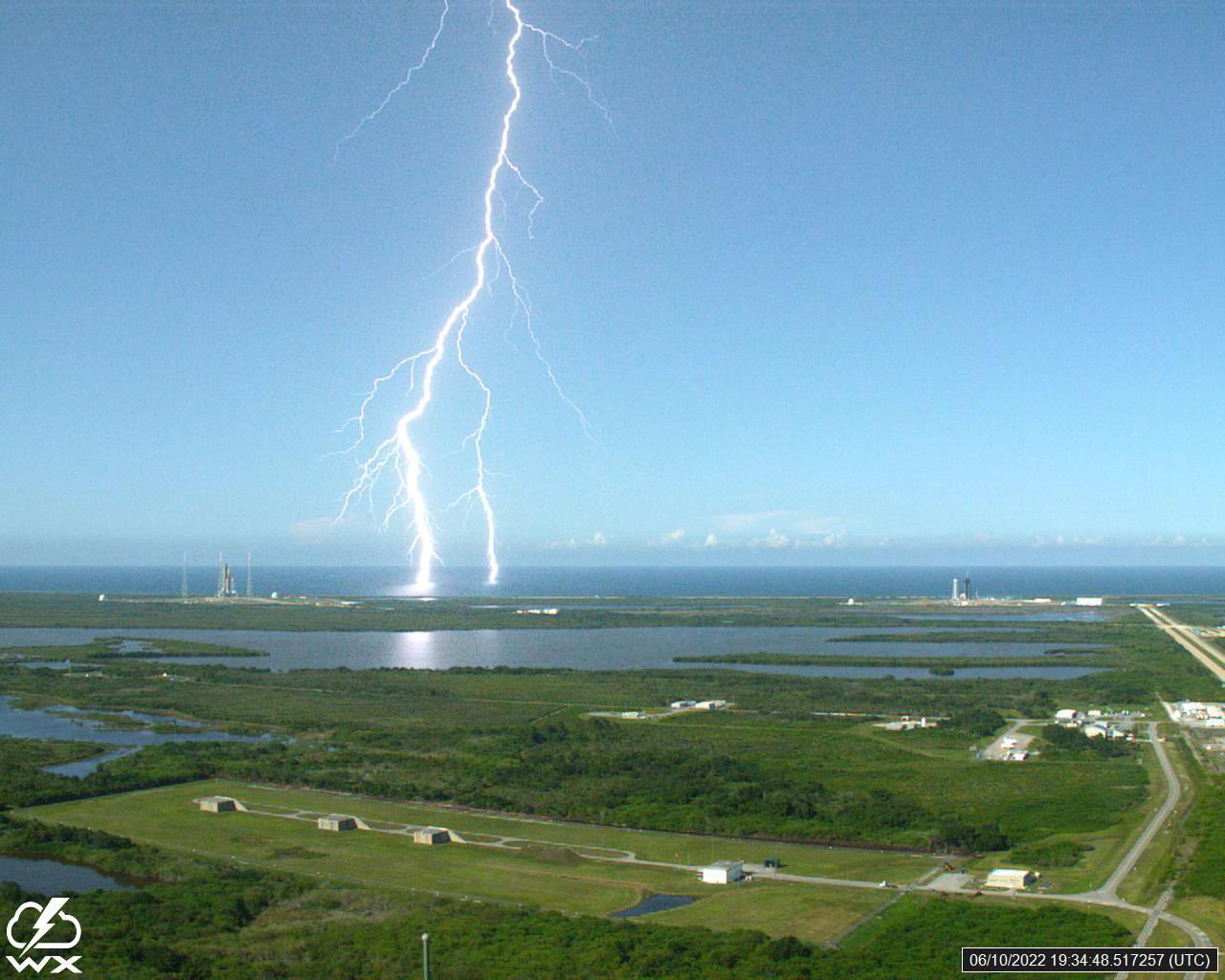 A lightning strike was recorded at Launch Complex 39B at NASA’s Kennedy Space Center in Florida on June 10, 2022. NASA’s Space Launch System (SLS) and Orion spacecraft atop the mobile launcher are on the launch pad in preparation for the Artemis I mission. The lightning strike was recorded by cameras stationed at the pad and mobile launcher using a special filter called a “clear day frame,” which provides an overlay of the raw frame on a reference image. Artemis I will be the first integrated test of the SLS and Orion spacecraft. In later missions, NASA will land the first woman and the first woman of color on the surface of the Moon, paving the way for a long-term lunar presence and serving as a steppingstone on the way to Mars. 