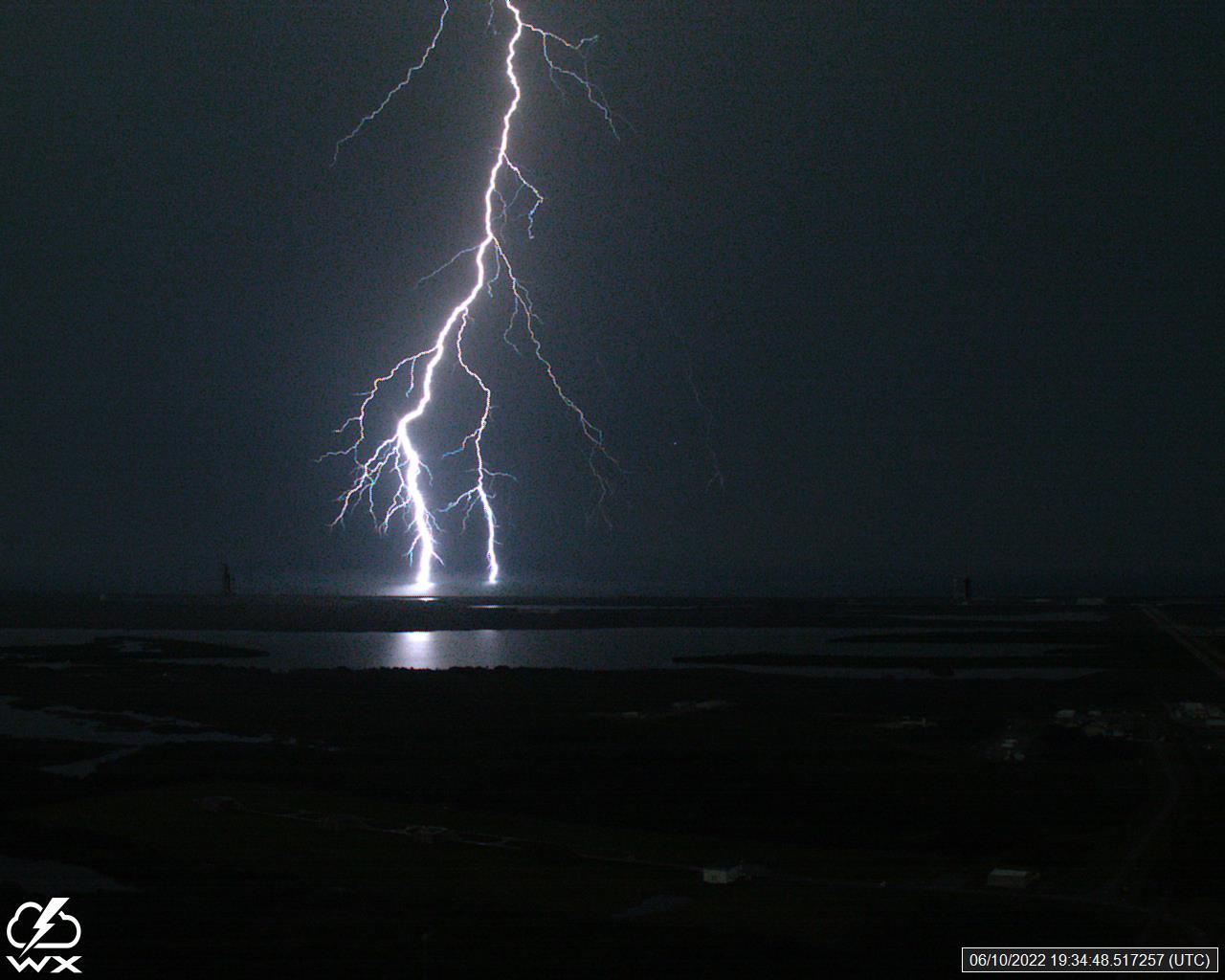 A lightning strike was recorded at Launch Complex 39B at NASA’s Kennedy Space Center in Florida on June 10, 2022. NASA’s Space Launch System (SLS) and Orion spacecraft atop the mobile launcher are on the launch pad in preparation for the Artemis I mission. The lightning strike was recorded by cameras stationed at the pad and mobile launcher using a special filter called a “clear day frame,” which provides an overlay of the raw frame on a reference image. Artemis I will be the first integrated test of the SLS and Orion spacecraft. In later missions, NASA will land the first woman and the first woman of color on the surface of the Moon, paving the way for a long-term lunar presence and serving as a steppingstone on the way to Mars. 