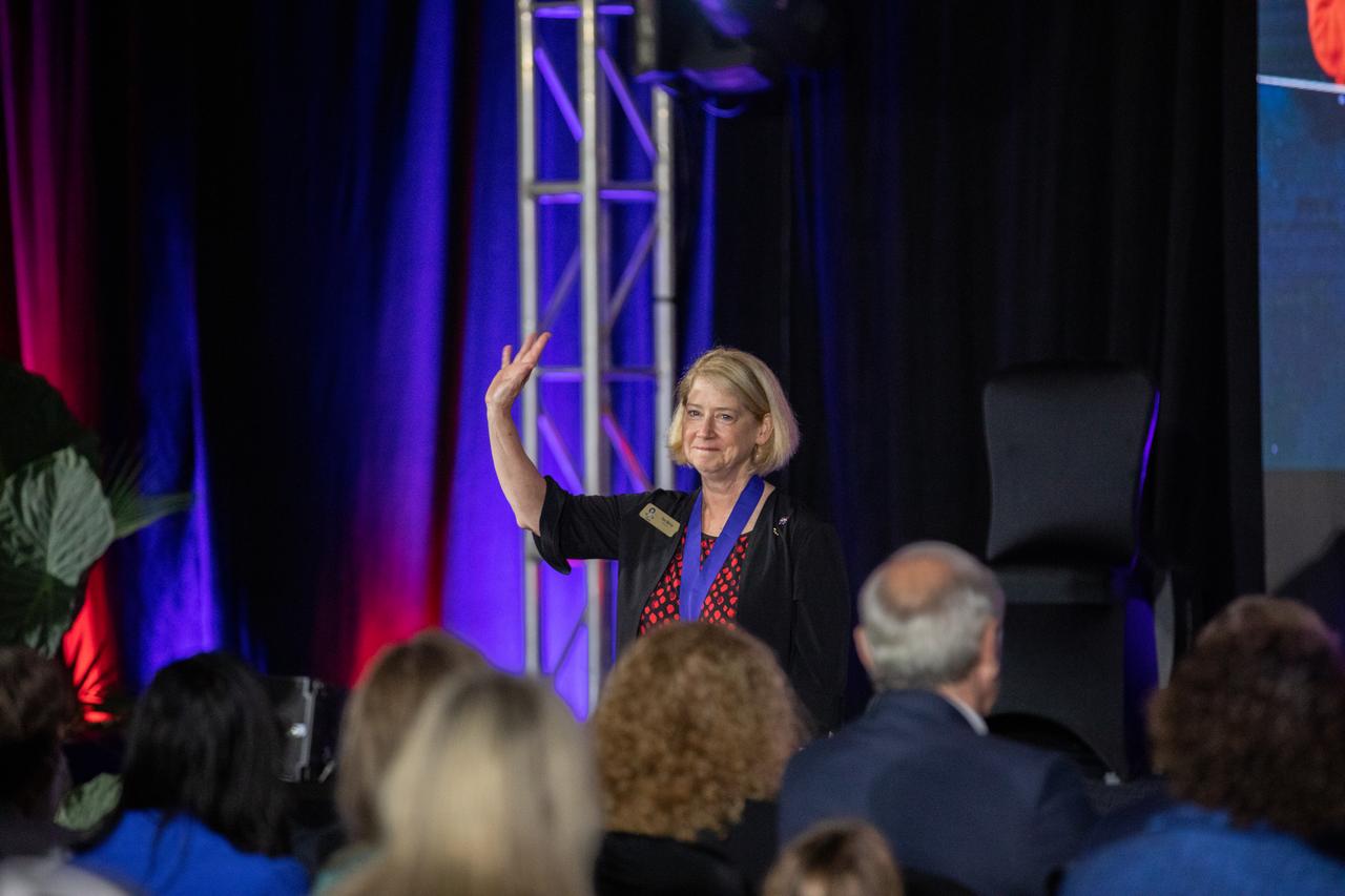 NASA Deputy Administrator Pam Melroy waves to attendees during the U.S. Astronaut Hall of Fame 2022 induction ceremony on June 11, 2022, at the Kennedy Space Center Visitor Complex in Florida. The 21st class of former astronauts, Chris Ferguson, David Leestma, and Sandra Magnus received medals and were inducted into the Hall of Fame. This year’s induction brings the total number of AHOF members to 105. The Class of 2022 were selected by a committee of Hall of Fame astronauts, former NASA officials, flight directors, historians, and journalists. During the ceremony, each of the inductees received an official medal. 