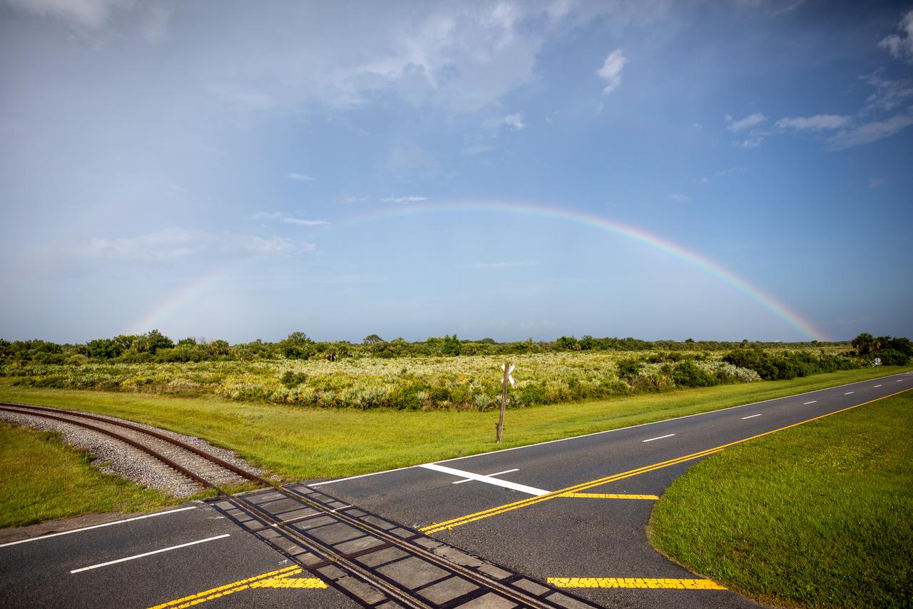 A full rainbow is in view over the Launch Complex 39B area at NASA’s Kennedy Space Center in Florida on June 12, 2022. The Artemis I Space Launch System and Orion spacecraft atop the mobile launcher were moved to Pad 39B atop the crawler-transport 2 for a prelaunch test called a wet dress rehearsal. Artemis I will be the first integrated test of the SLS and Orion spacecraft. In later missions, NASA will land the first woman and the first person of color on the surface of the Moon, paving the way for a long-term lunar presence and serving as a steppingstone on the way to Mars. 