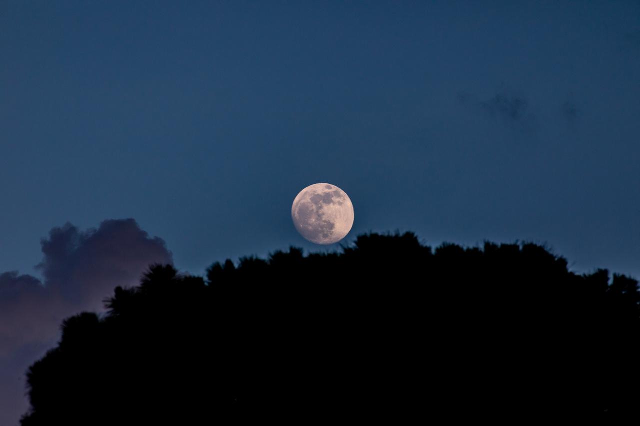 This almost full Moon shining in the eastern night sky was photographed on June 12, 2022, at NASA’s Kennedy Space Center in Florida. 