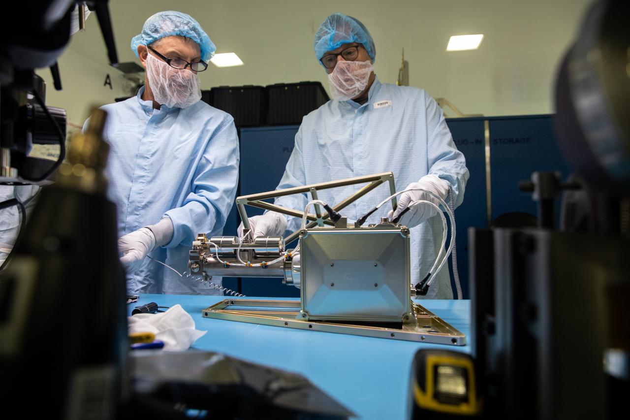 Inside the Space Station Processing Facility at NASA’s Kennedy Space Center in Florida, an engineer installs the Mass Spectrometer observing lunar operations (MSolo) onto its radiator bracket on June 14, 2022. Having successfully completed its thermal vacuum testing, the unit will undergo vibration testing later this month. This spectrometer is part of the PRIME-1 (Polar Resources Ice Mining Experiment-1) payload suite, slated to launch to the Moon in 2023 with Intuitive Machines. MSolo is a commercial off-the-shelf mass spectrometer modified to work in space and it will help analyze the chemical makeup of landing sites on the Moon, as well as study water on the lunar surface. MSolo is manifested to fly on four of the agency’s Commercial Lunar Payload Delivery Service missions where under Artemis, commercial deliveries beginning in 2023 will perform science experiments, test technologies, and demonstrate capabilities to help NASA explore the Moon and prepare for human missions.