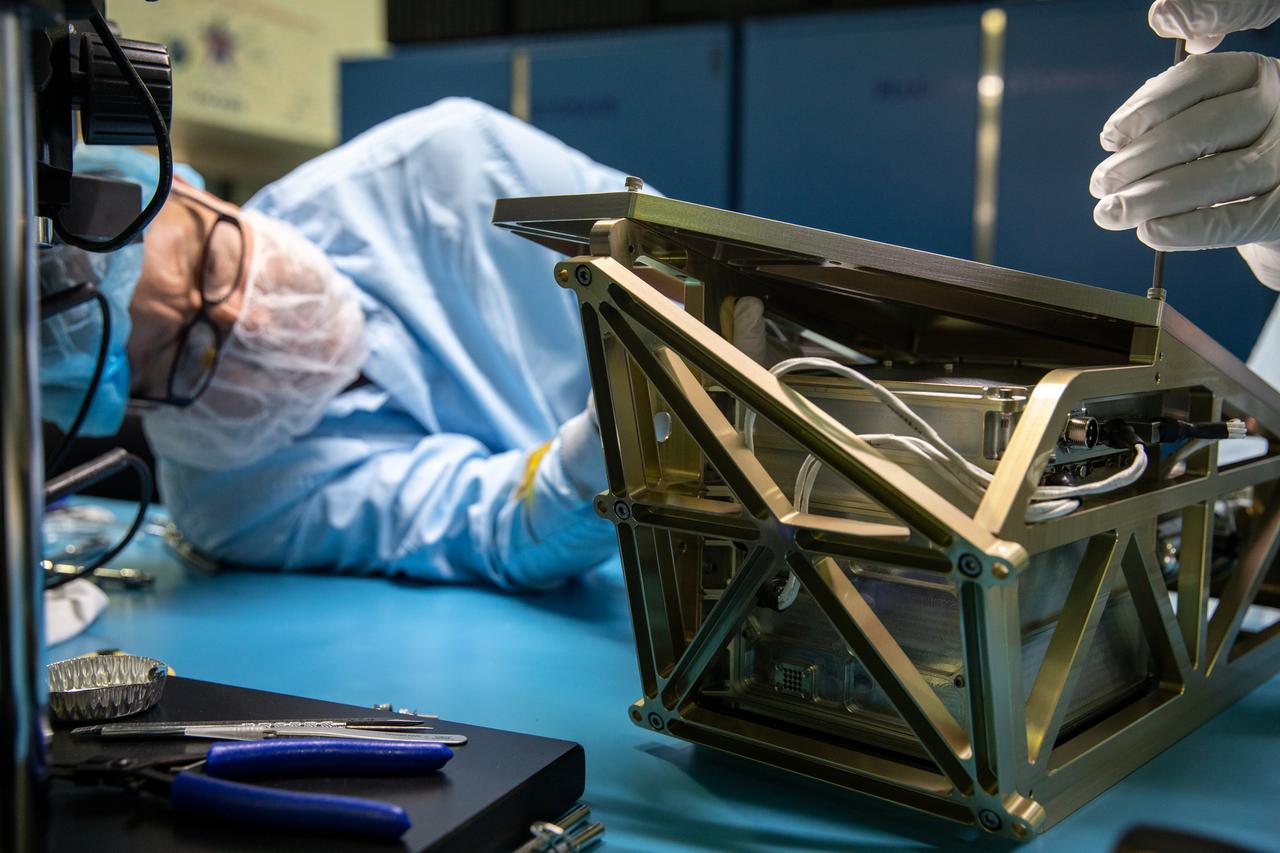 Inside the Space Station Processing Facility at NASA’s Kennedy Space Center in Florida, an engineer installs the Mass Spectrometer observing lunar operations (MSolo) onto its radiator bracket on June 14, 2022. Having successfully completed its thermal vacuum testing, the unit will undergo vibration testing later this month. This spectrometer is part of the PRIME-1 (Polar Resources Ice Mining Experiment-1) payload suite, slated to launch to the Moon in 2023 with Intuitive Machines. MSolo is a commercial off-the-shelf mass spectrometer modified to work in space and it will help analyze the chemical makeup of landing sites on the Moon, as well as study water on the lunar surface. MSolo is manifested to fly on four of the agency’s Commercial Lunar Payload Delivery Service missions where under Artemis, commercial deliveries beginning in 2023 will perform science experiments, test technologies, and demonstrate capabilities to help NASA explore the Moon and prepare for human missions.