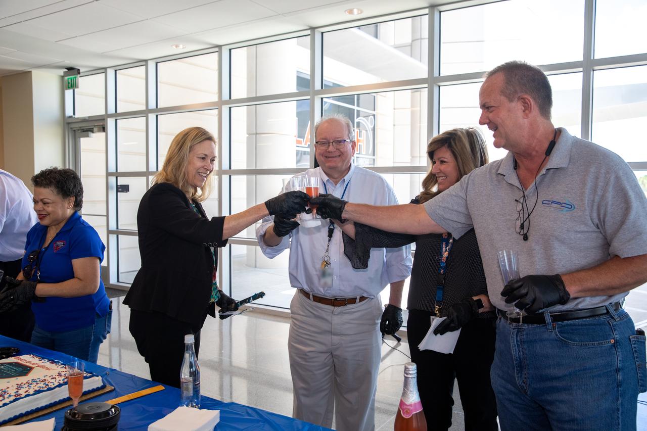 The NASA Kennedy Space Center senior leaders and employees celebrated the center’s 60th anniversary with a “Cheers to 60 Years” cake and non-alcoholic toast in the Central Campus Headquarters on June 28, 2022. From left are Janet Sellars, director of Human Resources; Janet Petro, center director; Burt Summerfield, associate center director, management; Jennifer Kunz, associate center director, technical; and Tom Engler, director of Center Planning and Development. In July 1962, the Launch Operations Center in Florida was established. By December 1963, it was renamed the John F. Kennedy Space Center.