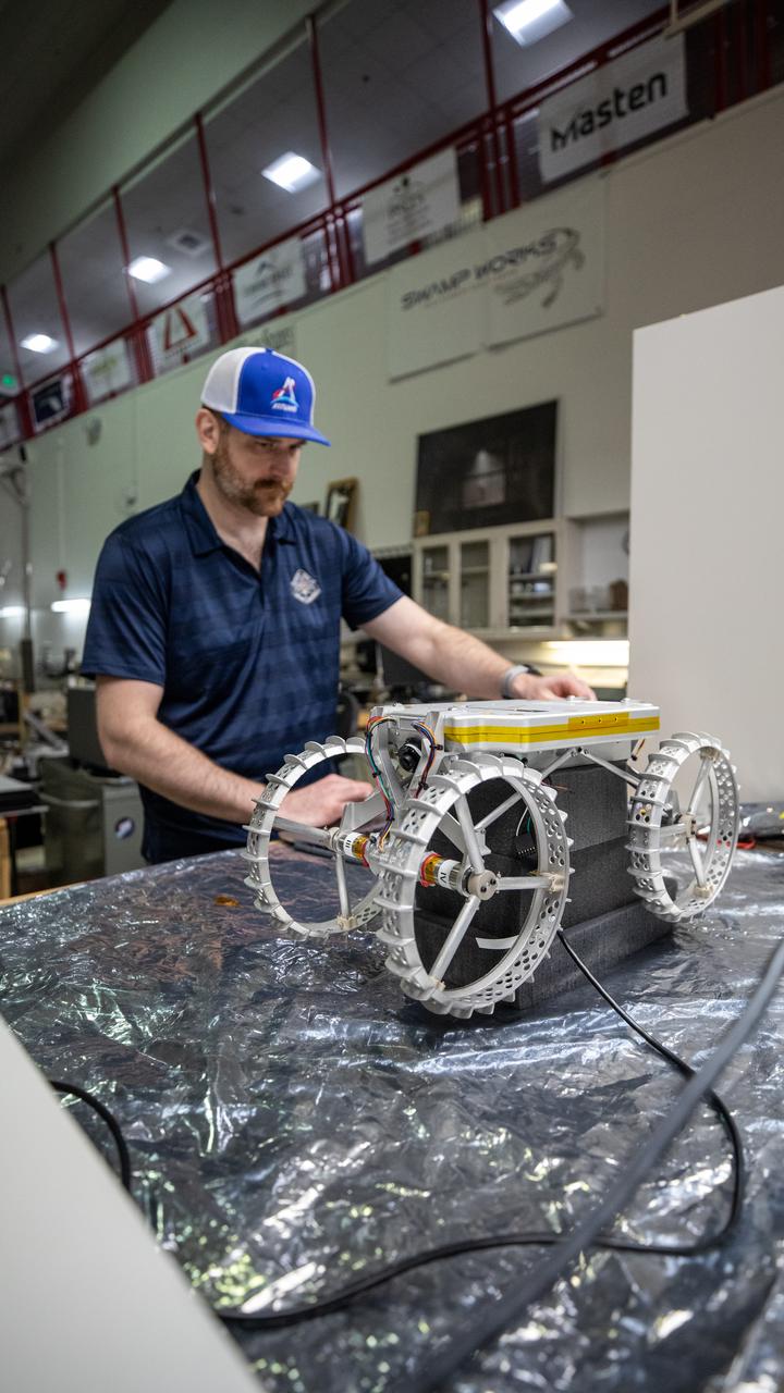 Robotics Software Engineer II Chris Rampolla runs benchtop verifications on Astrobotic’s CubeRover – a lightweight, modular planetary rover – before delivery to Swamp Works at NASA’s Kennedy Space Center in Florida on June 30, 2022. Astrobotic – a Pittsburgh-based space robotics company – is planning to use Swamp Work’s Granular Mechanics and Regolith Operations Laboratory’s regolith bin, which holds approximately 120 tons of lunar regolith simulant, to depict how the company’s CubeRover would perform on the Moon. NASA’s Small Business Innovation Research program provided the funding for initial development, and a $2 million Tipping Point award from the agency has provided additional funding for continued development into a more mature rover.