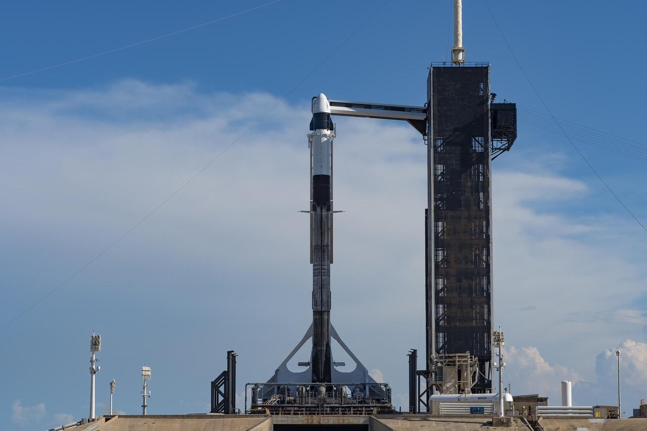 A SpaceX Falcon 9 rocket, with the company’s Cargo Dragon spacecraft atop, is raised to a vertical position at NASA Kennedy Space Center’s Launch Complex 39A on July 12, 2022, in preparation for the 25th commercial resupply services launch to the International Space Station. The mission will deliver new science investigations, supplies, and equipment to the crew aboard the orbiting laboratory. Liftoff is scheduled for 8:44 p.m. EDT on Thursday, July 14, from Kennedy’s Launch Complex 39A. 