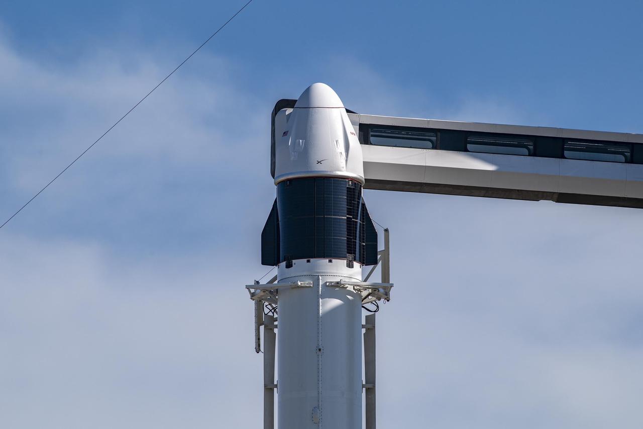 Seen here is a close view of the SpaceX Cargo Dragon spacecraft atop the company’s Falcon 9 rocket after being raised to a vertical position at NASA’s Kennedy Space Center in Florida on July 12, 2022, in preparation for the 25th commercial resupply services launch to the International Space Station. The mission will deliver new science investigations, supplies, and equipment to the crew aboard the orbiting laboratory. Liftoff is scheduled for 8:44 p.m. EDT on Thursday, July 14, from Kennedy’s Launch Complex 39A. 