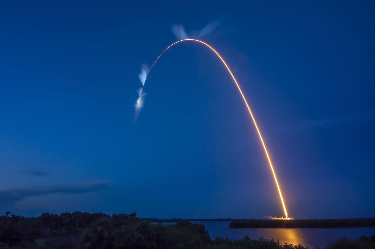 A bright white trail is in view after the SpaceX Falcon 9 rocket carrying the Dragon capsule lifts off from Launch Complex 39A at NASA’s Kennedy Space Center in Florida on July 14, 2022, on the company’s 25th Commercial Resupply Services mission for the agency to the International Space Station. Liftoff was at 8:44 p.m. EDT. Dragon will deliver more than 5,800 pounds of cargo, including a variety of NASA investigations, to the space station. The spacecraft is expected to spend about a month attached to the orbiting outpost before it returns to Earth with research and return cargo, splashing down off the coast of Florida. 