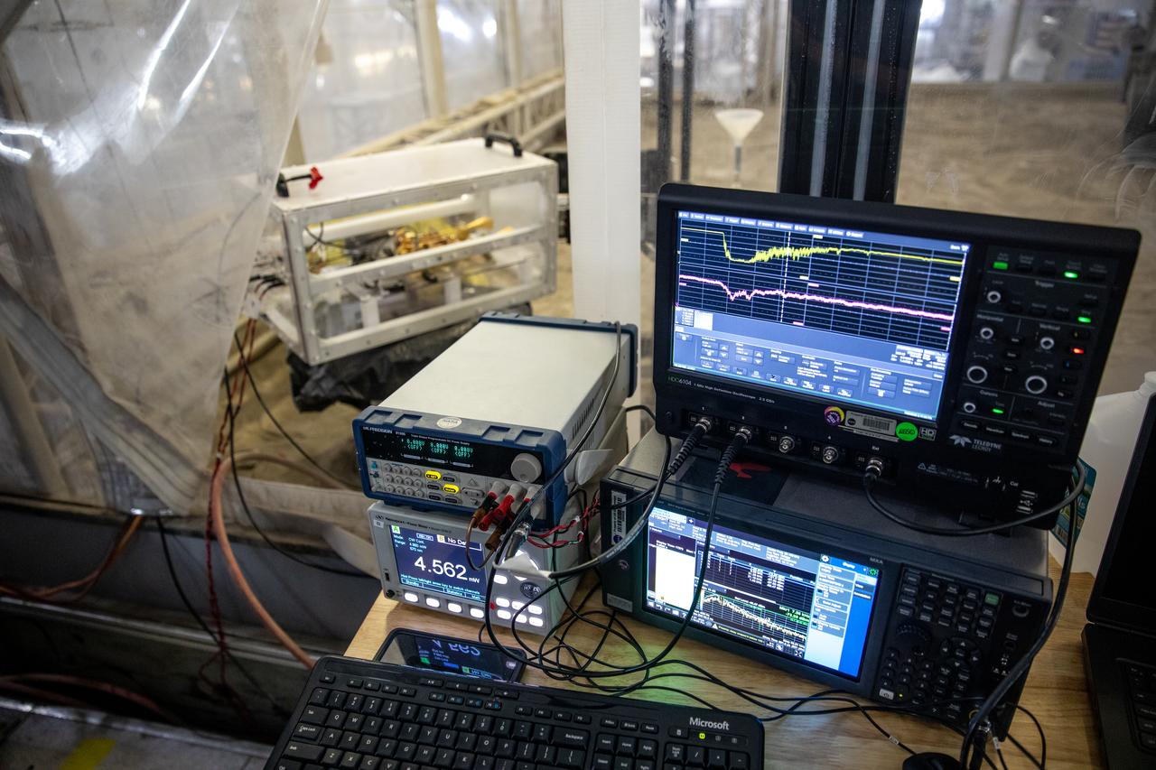 The Dust Concentration Monitor and the Millimeter Wave Doppler Radar undergo testing inside a regolith bin at the Granular Mechanics and Regolith Operations (GMRO) lab at the Kennedy Space Center’s Swamp Works on July 28, 2022, as part of Plume Surface Interaction (PSI) Instrumentation testing. The PSI Project is advancing both modeling and testing capabilities to understand exactly how rocket exhaust plumes affect a planetary landing site. This advanced modeling will help engineers evaluate the risks of various plumes on planetary surfaces, which will help them more accurately design landers for particular locations. 