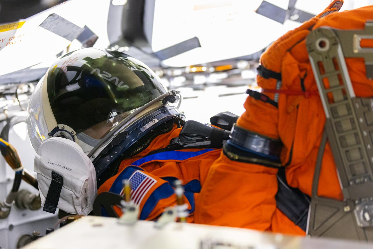 A close-up view of Moonikin “Campos” secured in a seat inside the Artemis I Orion crew module atop the Space Launch System rocket in High Bay 3 of the Vehicle Assembly Building at NASA’s Kennedy Space Center in Florida on Aug. 3, 2022.  Artemis I will provide a foundation for human deep space exploration and demonstrate NASA’s capability to extend human present to the Moon and beyond. The primary goal of Artemis I is to thoroughly test the Space Launch System rocket and Orion spacecraft’s integrated systems before crewed missions. Under Artemis, NASA aims to land the first woman and first person of color on the Moon and establish sustainable lunar exploration. 