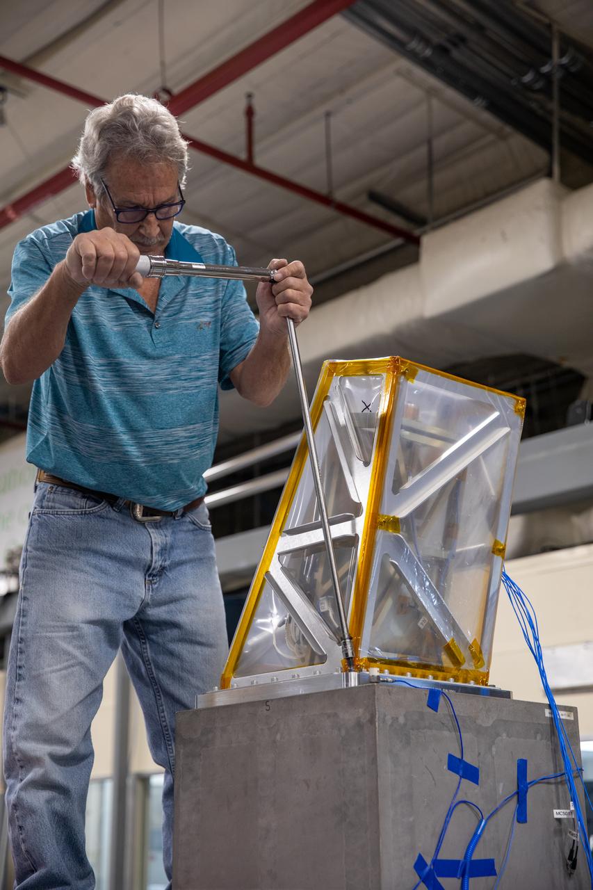 A Kennedy Space Center engineer prepares the Mass Spectrometer observing lunar operations (MSolo) instrument for vibration testing inside the Florida spaceport’s Cryogenics Laboratory on Aug. 3, 2022. MSolo is a commercial off-the-shelf mass spectrometer modified to work in space and will help analyze the chemical makeup of landing sites on the Moon, as well as study water on the lunar surface. Researchers and engineers are preparing MSolo instruments to launch on four robotic missions as part of NASA’s Commercial Lunar Payload Services (CLPS) – commercial deliveries that will perform science experiments, test technologies, and demonstrate capabilities to help NASA explore the Moon and prepare for crewed missions to the lunar surface. This particular MSolo instrument is slated to fly on the agency’s Polar Resources Ice Mining Experiment-1 (PRIME-1) mission – the first in-situ resource utilization demonstration on the Moon – as part of the agency’s CLPS initiative.