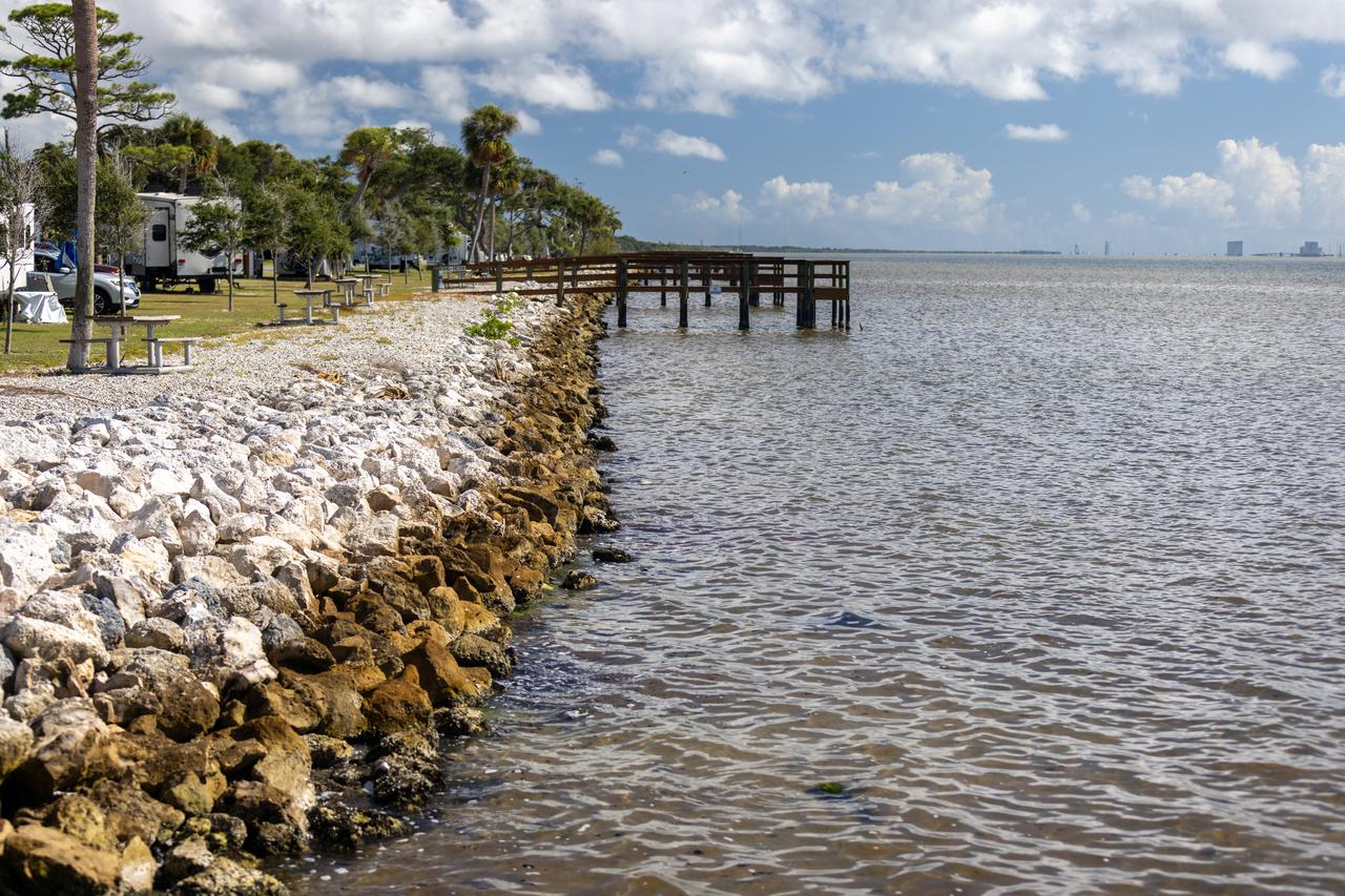 NASA Kennedy Space Center’s Spaceport Integration and Services organization is leading a restoration project at KARS Park on Hall Road in Merritt Island, Florida. As part of this project, a wavebreak is being created about 20 feet offshore to allow mangroves and other plants to propagate into the gap, providing protection for the shoreline. Shown here is the section of KARS park that was first completed during the project.