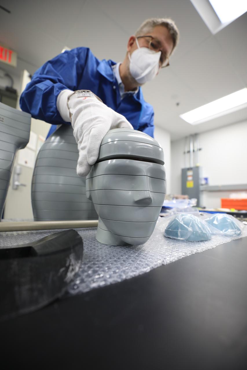 In preparation for the Artemis I flight test, teams at NASA’s Kennedy Space Center in Florida prepare two manikins, called phantoms, as part of the Matroshka AstroRad Radiation Experiment (MARE) investigation on Aug. 4, 2022. The two female phantoms – Helga and Zohar – will fly aboard the Orion crew module during Artemis I. Each will be equipped with radiation detectors, with Zohar also wearing a radiation protection vest, to determine the radiation risk on its way to the Moon. The MARE experiment is part of an agreement between NASA, the Israel Space Agency, and the German Aerospace Center. Artemis I will provide a foundation for human deep space exploration and demonstrate NASA’s capability to extend human presence to the Moon and beyond. The primary goal of Artemis I is to thoroughly test the Space Launch System rocket and Orion spacecraft’s integrated systems before crewed missions. Under Artemis, NASA aims to land the first woman and first person of color on the Moon and establish sustainable lunar exploration.