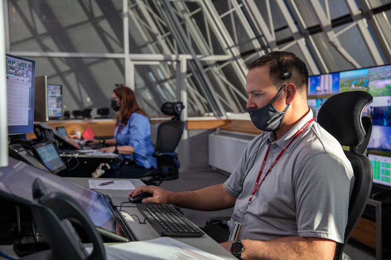 Artemis teams conduct the final simulation for the Artemis I mission inside the Launch Control Center at NASA’s Kennedy Space Center in Florida on Aug. 4, 2022. Artemis I will be the first integrated test of NASA’s Space Launch System (SLS) rocket and Orion spacecraft. During the flight, Orion will launch atop the most powerful rocket in the world and fly farther than any spacecraft for humans has ever flown. The spacecraft will stay in space longer than any human spacecraft has without docking to the International Space Station and return home faster than ever before. Shown here is Wes Mosedale, the technical assistant to Artemis Launch Director Charlie Blackwell-Thompson.