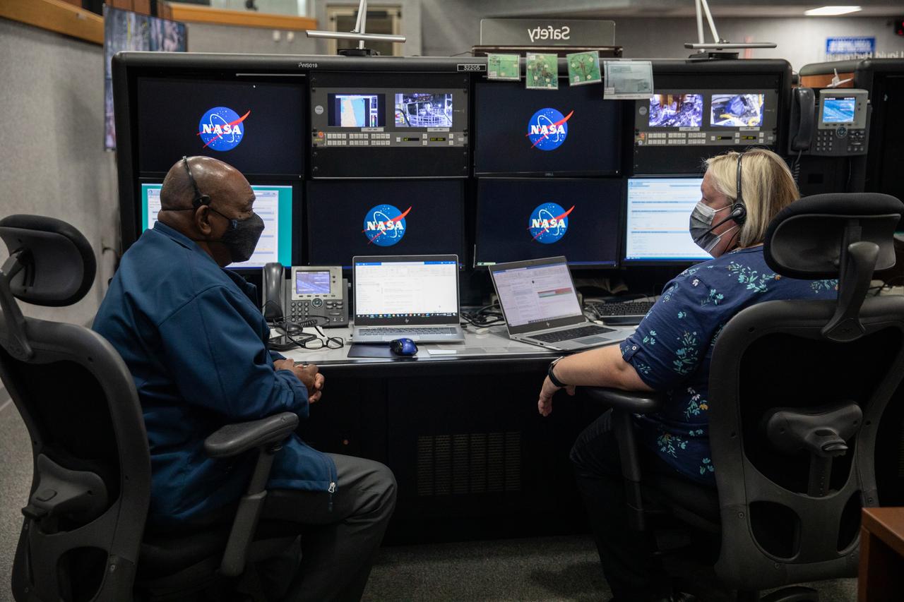 Artemis teams conduct the final simulation for the Artemis I mission inside the Launch Control Center at NASA’s Kennedy Space Center in Florida on Aug. 4, 2022. Artemis I will be the first integrated test of NASA’s Space Launch System (SLS) rocket and Orion spacecraft. During the flight, Orion will launch atop the most powerful rocket in the world and fly farther than any spacecraft for humans has ever flown. The spacecraft will stay in space longer than any human spacecraft has without docking to the International Space Station and return home faster than ever before. Shown here, from left to right, is Bubba Howard and Lisa DeVries, who are in charge of the safety console.