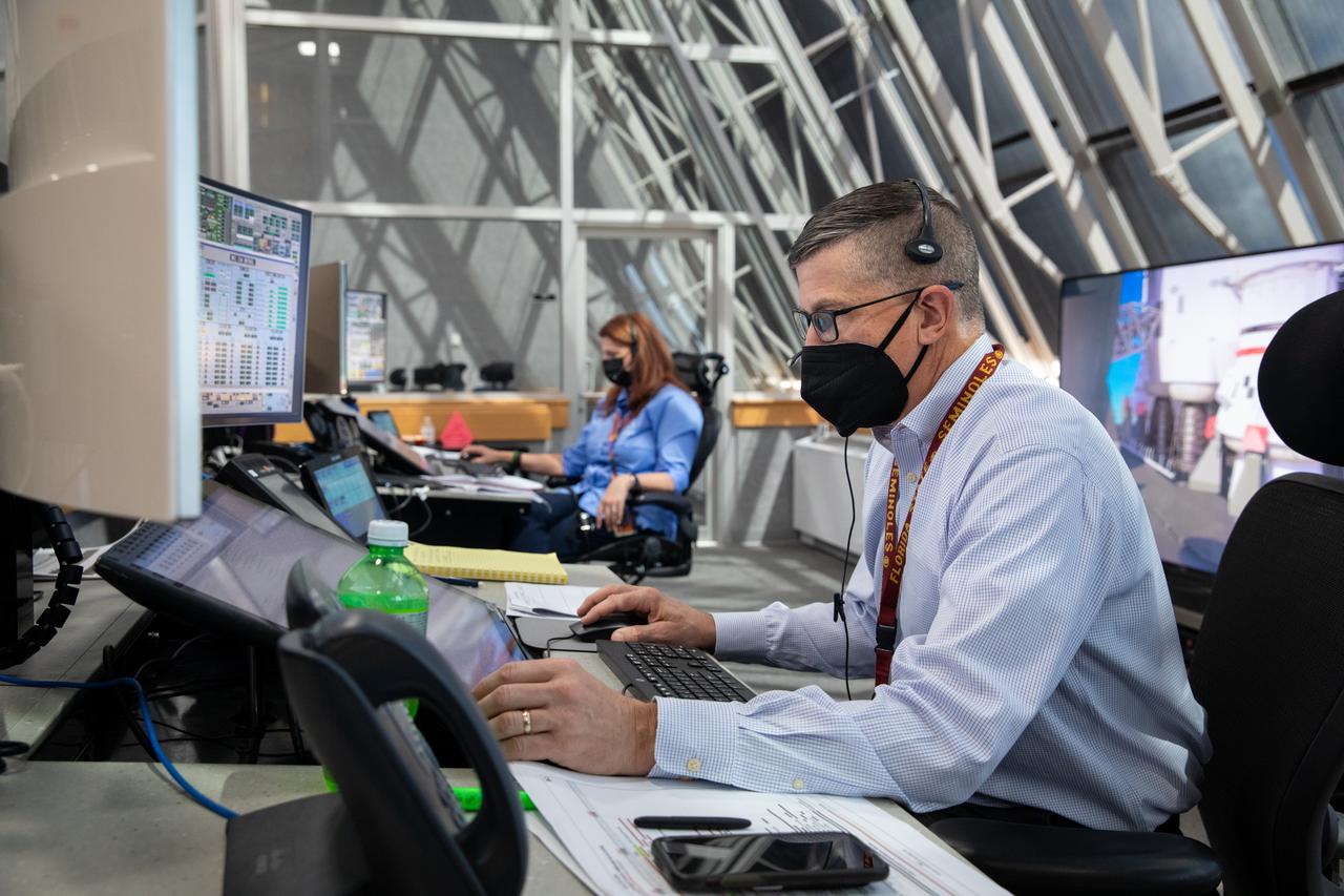 Artemis teams conduct the final simulation for the Artemis I mission inside the Launch Control Center at NASA’s Kennedy Space Center in Florida on Aug. 4, 2022. Artemis I will be the first integrated test of NASA’s Space Launch System (SLS) rocket and Orion spacecraft. During the flight, Orion will launch atop the most powerful rocket in the world and fly farther than any spacecraft for humans has ever flown. The spacecraft will stay in space longer than any human spacecraft has without docking to the International Space Station and return home faster than ever before. Shown here is Assistant Launch Director Jeremy Graeber and Launch Director Charlie Blackwell-Thompson.