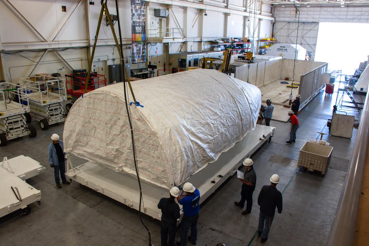 A crew offloaded the United Launch Alliance (ULA) Atlas V payload fairing from its transport container in building B7525 at Vandenberg Space Force Base (VSFB) in California on Aug. 8, 2022, for NASA and the National Oceanic and Atmospheric Administration’s (NOAA) Joint Polar Satellite System-2 (JPSS-2) satellite mission. JPSS-2 is the third satellite in the Joint Polar Satellite System series. It is scheduled to lift off from VSFB on Nov. 1 from Space Launch Complex-3 East. JPSS-2 will scan the globe as it orbits from the North to the South Pole, crossing the equator 14 times a day. From 512 miles above Earth, it will capture data that inform weather forecasts, extreme weather events, and climate change. The Visible Infrared Radiometer Suite instrument will collect imagery for global observations of the land, atmosphere, cryosphere, and oceans. Launching as a secondary payload to JPSS-2 is NASA’s Low-Earth Orbit Flight Test of an Inflatable Decelerator (LOFTID), dedicated to the memory of Bernard Kutter. LOFTID is a demonstration of a hypersonic inflatable aerodynamic decelerator, or aeroshell, technology that could one day help land humans on Mars.