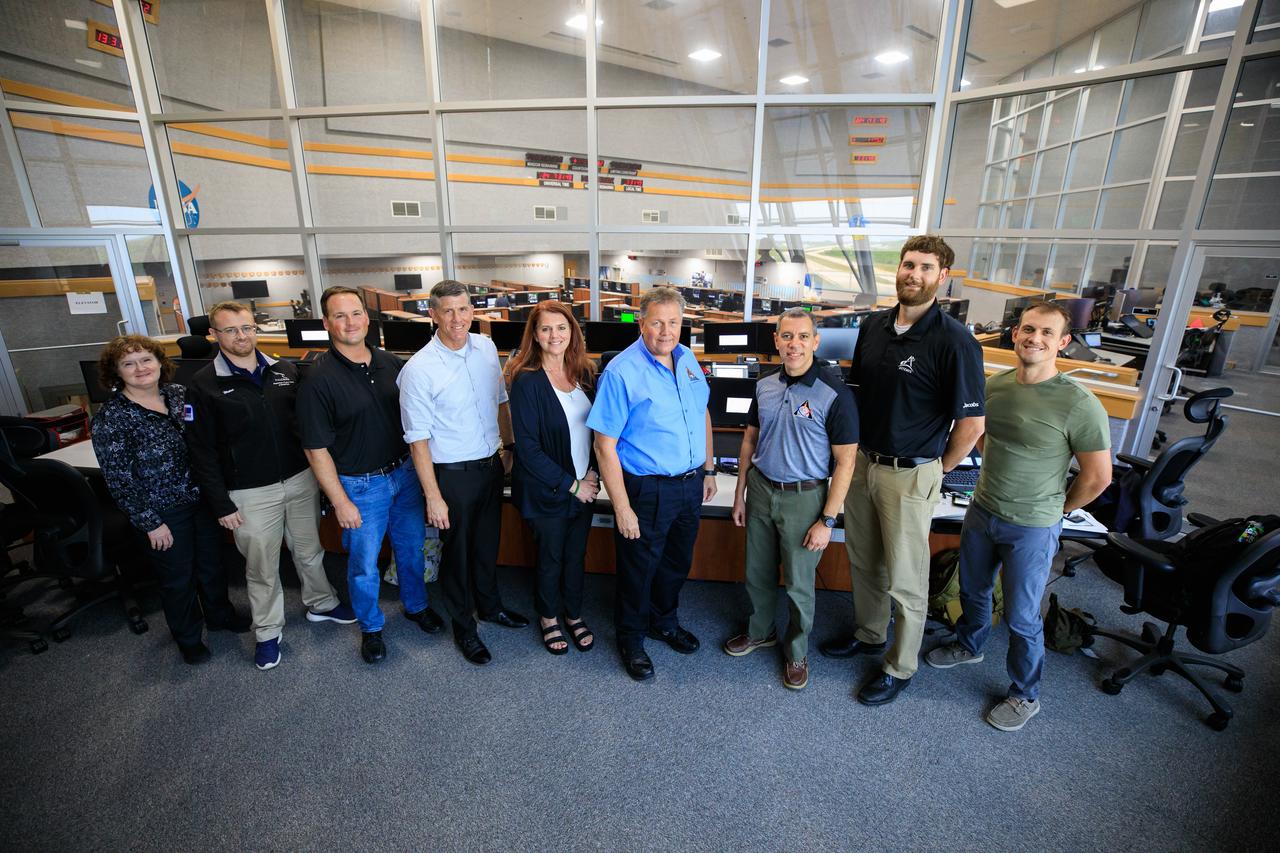 Members of the Artemis I launch team are photographed inside Firing Room 1 of the Rocco A. Petrone Launch Control Center at NASA’s Kennedy Space Center in Florida prior to a certification ceremony on Aug. 12, 2022. From left are Laurie Sally, Space Launch System (SLS) test conductor; Josh Waters, assistant ground test conductor; Wes Mosedale, technical assistant to the launch director; Jeremy Graeber, assistant launch director; Charlie Blackwell-Thompson, launch director; Jeff Spaulding, senior NASA test director; Danny Zeno, NASA test director; Lucas Vojak, assistant Orion test conductor; and Terry Woxberg, Orion test conductor. The ceremony was held to commemorate the certification of the Artemis I launch team following their launch simulation held in December 2021. During the ceremony, senior members of the launch team handed out certificates to individual team members. The first in an increasingly complex series of missions, Artemis I will test the SLS rocket and Orion spacecraft as an integrated system prior to crewed flights to the Moon. Through Artemis, NASA will land the first woman and the first person of color on the lunar surface, paving the way for long-term lunar presence and using the Moon as a steppingstone before venturing to Mars.