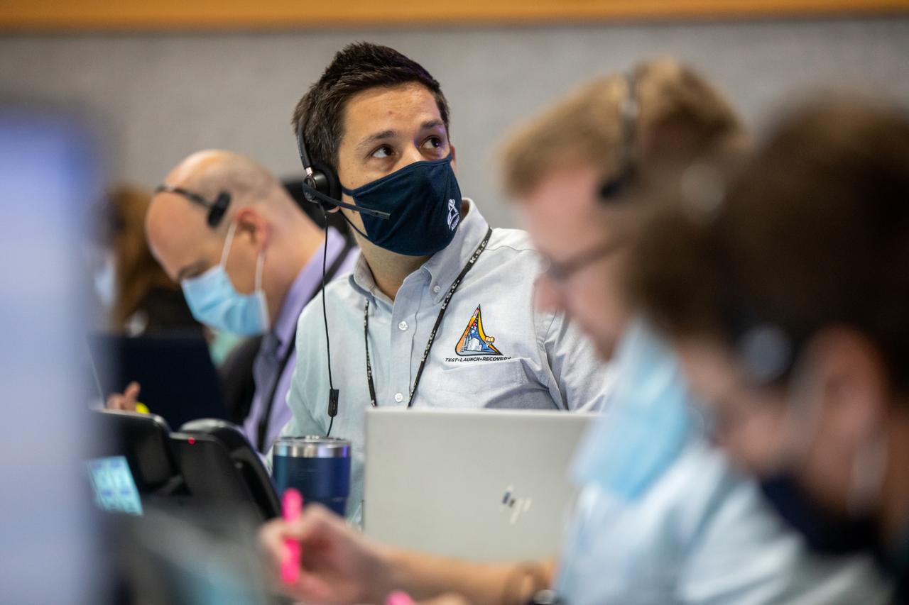 NASA Test Director Dan Florez watches the agency’s Space Launch System (SLS) rocket with the Orion spacecraft through the windows of Firing Room 1 in the Rocco A. Petrone Launch Control Center atop a mobile launcher as it rolls out of High Bay 3 of the Vehicle Assembly Building to Launch Complex 39B, on Tuesday, Aug. 16, 2022, ahead of the agency’s Artemis I flight test. The fully stacked and integrated SLS rocket and Orion spacecraft is scheduled to liftoff on Monday, Aug. 29. The first in a series of increasingly complex missions, Artemis I will provide a foundation for human deep space exploration and demonstrate our commitment and capability to extend human presence to the Moon and beyond. The primary goal of Artemis I is to thoroughly test the integrated systems before crewed missions by launching Orion atop the SLS rocket, operating the spacecraft in a deep space environment, testing Orion’s heat shield, and recovering the crew module after reentry, descent, and splashdown. In later missions, NASA will land the first woman and the first person of color on the surface of the Moon, paving the way for a long-term lunar presence and serving as a steppingstone on the way to Mars.