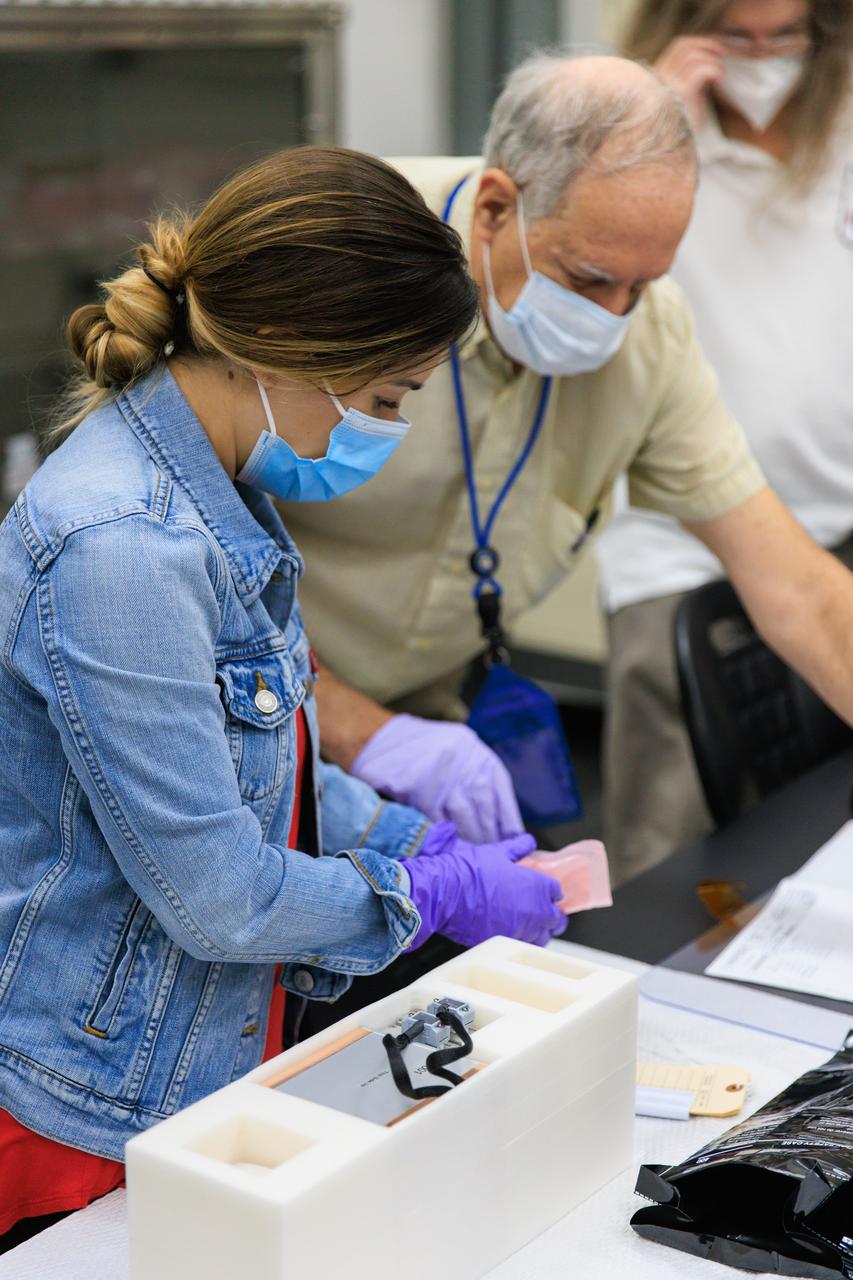 Scientists package up part of NASA’s Biology Experiment-1 (BioExpt-1) for official handover to the Orion team for Artemis I inside the Space Station Processing Facility at the agency’s Kennedy Space Center in Florida on Aug. 18, 2022. BioExpt-1 is a space biology pathfinder, which will carry Arabidopsis, algae, yeast, and fungi science payloads for biology research beyond low-Earth orbit aboard the Orion capsule on the Artemis I mission. The payload container assemblies will be installed onto panels in the Orion capsule and will return to Earth to provide critical and unique data about life beyond low-Earth orbit for the first time in more than 40 years. Artemis I is the first in a series of increasingly complex missions that will enable human exploration to the Moon and eventually on to Mars.