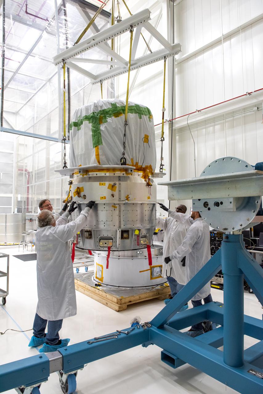 Technicians move NASA’s Low-Earth Orbit Flight Test of an Inflatable Decelerator (LOFTID) re-entry vehicle over to a turnover fixture for prelaunch processing inside Building 836 at Vandenberg Space Force Base in California on Aug. 19, 2022. Dedicated to the memory of Bernard Kutter, LOFTID is a technology demonstration mission aimed at validating inflatable heat shield technology for atmospheric re-entry. This technology could enable missions to other planetary bodies, as well as allow NASA to return heavier payloads from low-Earth orbit. LOFTID is a rideshare launching with the National Oceanic and Atmospheric Administration’s (NOAA) Joint Polar Satellite System-2 (JPSS-2) satellite. NASA and NOAA are targeting Nov. 1, 2022, for the launch of JPSS-2 on a United Launch Alliance Atlas V rocket from Space Launch Complex-3 at Vandenberg.