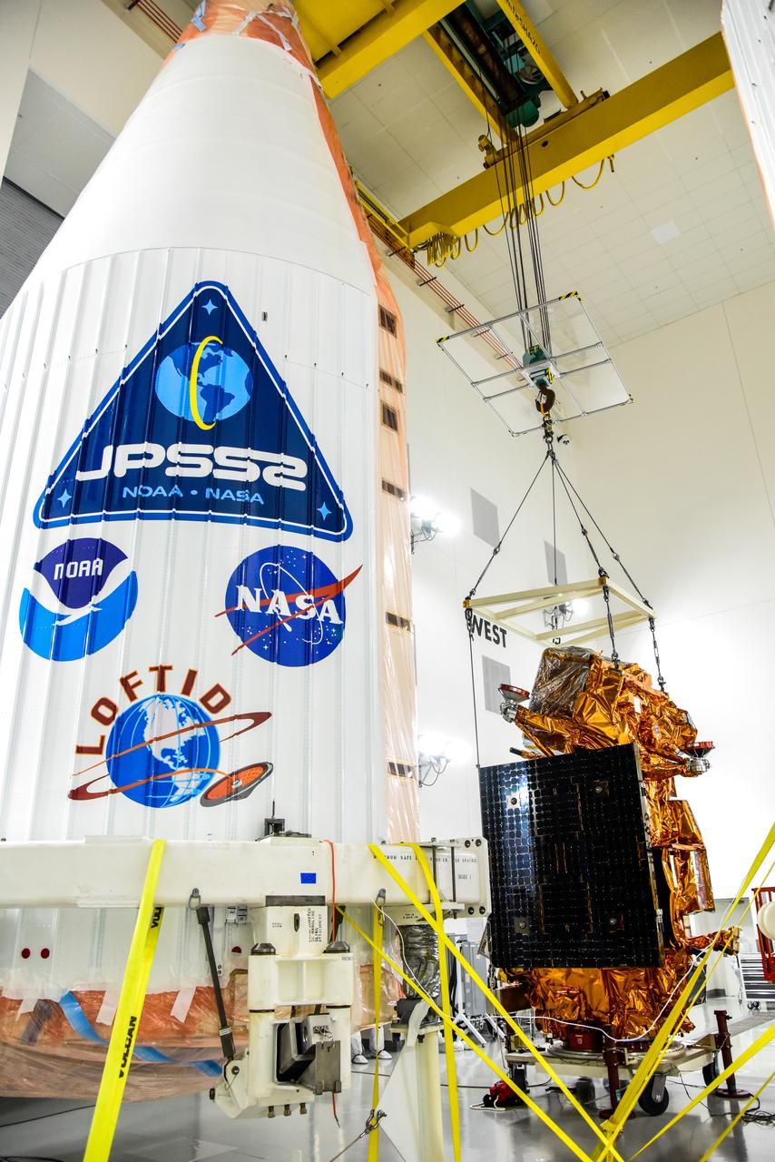 A crane is used to lift NASA and the National Oceanic and Atmospheric Administration’s (NOAA) Joint Polar Satellite System-2 (JPSS-2) satellite for transfer to an Aronson Table for processing inside the Astrotech Space Operations facility at Vandenberg Space Force Base in California on Aug. 22, 2022. JPSS-2 is the third satellite in the Joint Polar Satellite System series. It is scheduled to lift off from VSFB on Nov. 1 from Space Launch Complex-3. JPSS-2, which will be renamed NOAA-21 after reaching orbit, will join a constellation of JPSS satellites that orbit from the North to the South pole, circling Earth 14 times a day and providing a full view of the entire globe twice daily. The NOAA/NASA Suomi National Polar-orbiting Partnership (Suomi NPP) satellite, and NOAA-20, previously known as JPSS-1, are both already in orbit. Each satellite carries at least four advanced instruments to measure weather and climate conditions on Earth. A secondary payload on the mission is the Low-Earth Orbit Flight Test of an Inflatable Decelerator (LOFTID), and is dedicated to the memory of Bernard Kutter. LOFTID will demonstrate inflatable heat shield technology that could enable a variety of proposed NASA missions to destinations such as Mars, Venus, and Titan, as well as returning heavier payloads from low-Earth orbit. 