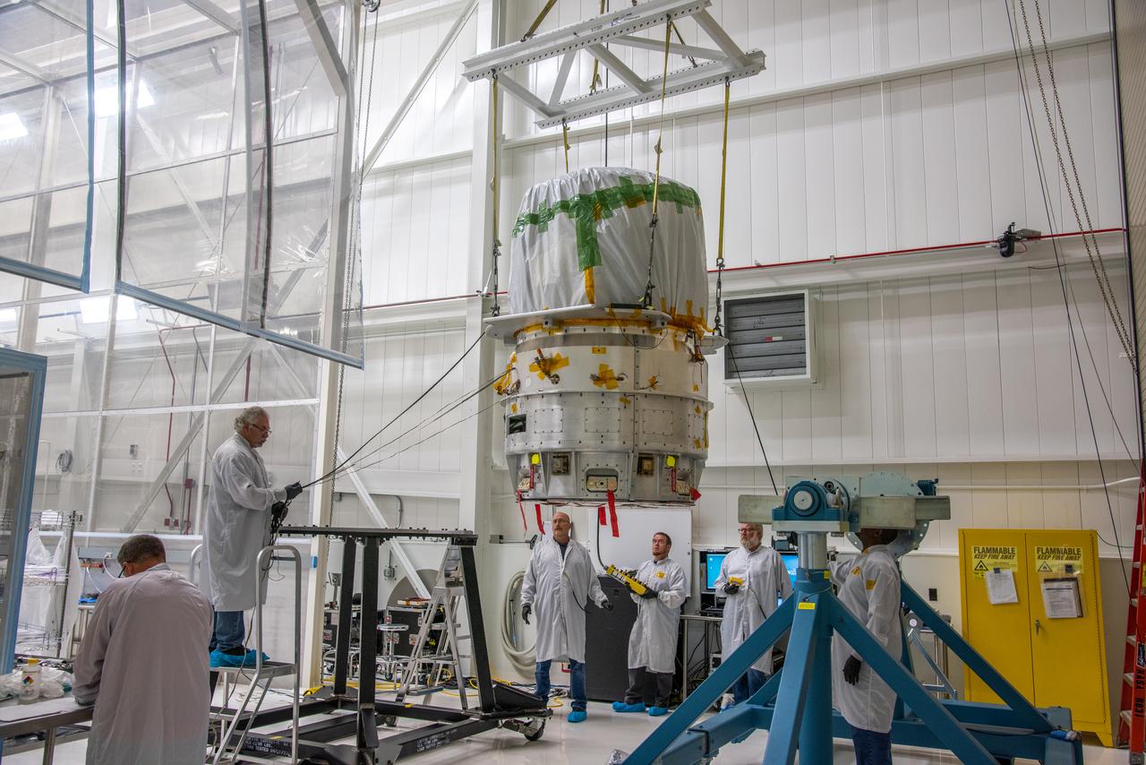 The Low-Earth Orbit Flight Test of an Inflatable Decelerator (LOFTID) is lifted for its move to a work stand inside Building 836 at Vandenberg Space Force Base (VSFB) in California on Aug. 25, 2022. LOFTID is the secondary payload on NASA and the National Oceanic and Atmospheric Administration’s (NOAA) Joint Polar Satellite System-2 (JPSS-2) satellite mission. JPSS-2 is the third satellite in the Joint Polar Satellite System series. It is scheduled to lift off from VSFB on Nov. 1 from Space Launch Complex-3. JPSS-2, which will be renamed NOAA-21 after reaching orbit, will join a constellation of JPSS satellites that orbit from the North to the South pole, circling Earth 14 times a day and providing a full view of the entire globe twice daily. The NOAA/NASA Suomi National Polar-orbiting Partnership (Suomi NPP) satellite, and NOAA-20, previously known as JPSS-1, are both already in orbit. Each satellite carries at least four advanced instruments to measure weather and climate conditions on Earth. LOFTID is dedicated to the memory of Bernard Kutter. LOFTID will demonstrate inflatable heat shield technology that could enable a variety of proposed NASA missions to destinations such as Mars, Venus, and Titan, as well as returning heavier payloads from low-Earth orbit. 