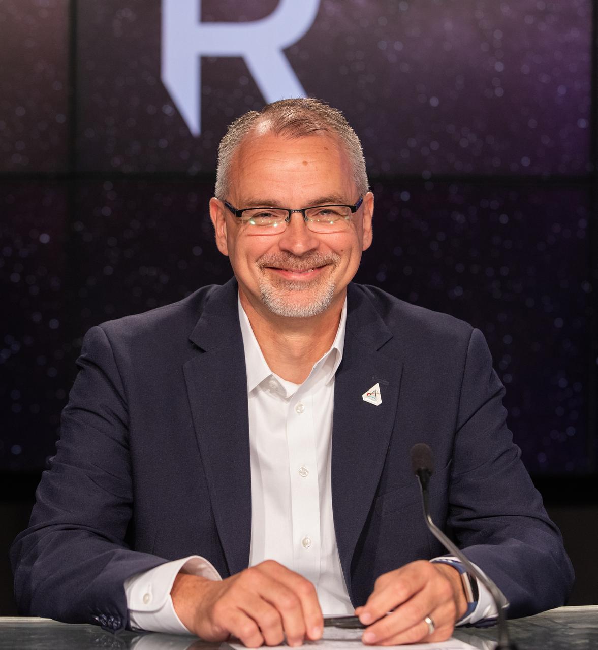 Jim Free, association administrator, Exploration Systems Development Mission Directorate, NASA Headquarters, participates in a prelaunch media briefing on the role of industry in advancing human exploration on Aug. 26, 2022, at NASA’s Kennedy Space Center in Florida, as the agency prepares for launch of Artemis I scheduled for Aug. 29, at 8:33 a.m. EDT from Kennedy’s Launch Complex 39B. The first in a series of increasingly complex missions, Artemis I will provide a foundation for human deep space exploration and demonstrate our commitment and capability to extend human presence to the Moon and beyond. The primary goal of Artemis I is to thoroughly test the integrated systems before crewed missions by operating the spacecraft in a deep space environment, testing Orion’s heat shield, and recovering the crew module after reentry, descent, and splashdown. 