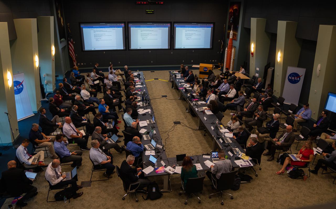 Artemis I managers hold a final briefing on Aug. 26, 2022, at NASA’s Kennedy Space Center in Florida to confirm all is ready for launch team call to stations in Firing Room 1 of the Rocco A Petrone Launch Control Center. The agency’s Space Launch System rocket and Orion spacecraft are scheduled to launch no earlier than Aug. 29, 2022, at 8:33 a.m. EDT from Kennedy’s Launch Complex 39B. The first in a series of increasingly complex missions, Artemis I will provide a foundation for human deep space exploration and demonstrate our commitment and capability to extend human presence to the Moon and beyond. The primary goal of Artemis I is to thoroughly test the integrated systems before crewed missions by operating the spacecraft in a deep space environment, testing Orion’s heat shield, and recovering the crew module after reentry, descent, and splashdown.