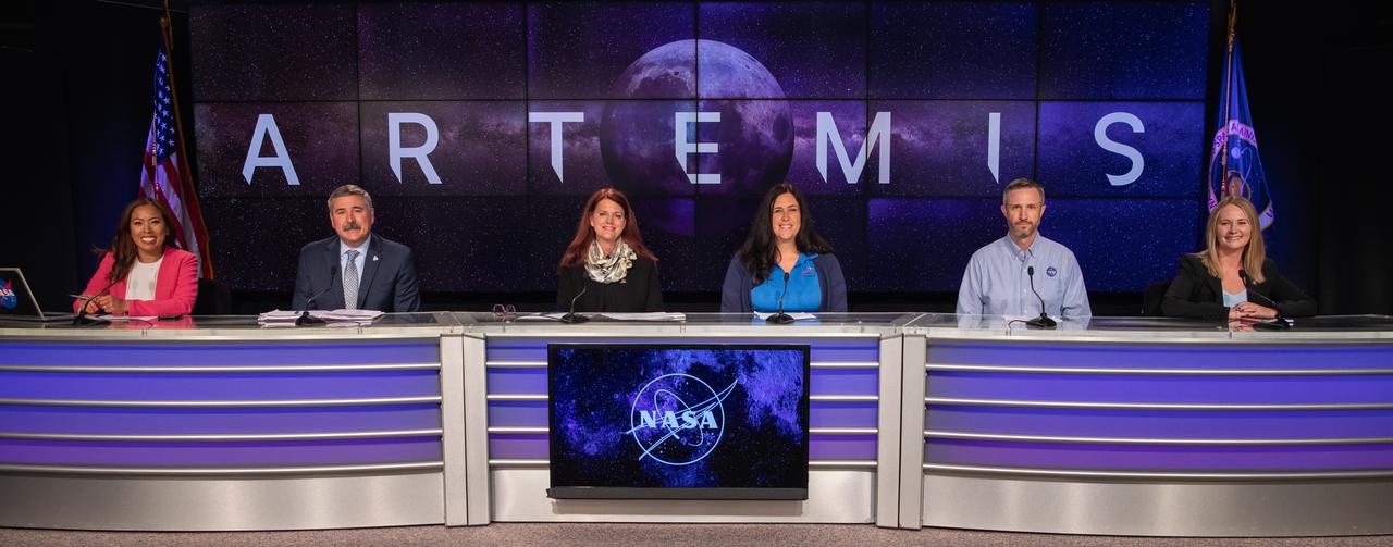 From left, Megan Cruz, NASA Communications; Mike Sarafin, Artemis mission manager, NASA Headquarters; Charlie Blackwell-Thompson, Artemis launch director, Kennedy Space Center; Melissa Jones, recovery director, Exploration Ground Systems Program, Kennedy; Jacob Bleacher, chief exploration scientist, Exploration Systems Development Mission Directorate, NASA Headquarters; and Melody Lovin, weather officer, Space Launch Delta 45, participate in an Artemis I mission status press briefing at Kennedy on Aug. 27, 2022. NASA’s Space Launch System rocket and Orion spacecraft are targeted to lift off from Kennedy’s Launch Complex 39B no earlier than Aug. 29, 2022, at 8:33 a.m. EDT.