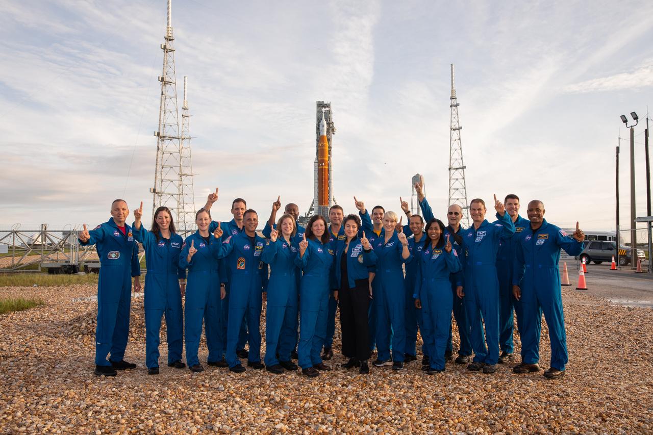 Astronauts and astronaut candidates from NASA and the Canadian Space Agency pose for a photograph in front of NASA’s Artemis I Space Launch System and Orion spacecraft atop the mobile launcher on the pad at Launch Complex 39B on Aug. 28, 2022. The astronauts are, from left to right: Randy Bresnik, NASA astronaut; Christina Birch, NASA astronaut candidate; Jessica Wittner, NASA astronaut candidate; Joshua Kutryk, Canadian Space Agency astronaut; Joe Acaba, NASA astronaut; Zena Cardman, NASA astronaut; Andre Douglas, NASA astronaut candidate; Shannon Walker, NASA astronaut; Reid Wiseman, NASA astronaut; Jessica Meir, NASA astronaut; Jack Hathaway, NASA astronaut candidate; Kate Rubins, NASA astronaut; Chris Williams, NASA astronaut candidate; Stephanie Wilson, NASA astronaut; Don Pettit, NASA astronaut; Stan Love, NASA astronaut; Jeremy Hansen, Canadian Space Agency astronaut; Victor Glover, NASA astronaut. Artemis I is scheduled to launch Aug. 29, at 8:33 a.m. EDT. The first in a series of increasingly complex missions, Artemis I will provide a foundation for human deep space exploration and demonstrate our commitment and capability to extend human presence to the Moon and beyond. The primary goal of Artemis I is to thoroughly test the integrated systems before crewed missions by operating the spacecraft in a deep space environment, testing Orion’s heat shield, and recovering the crew module after reentry, descent, and splashdown.