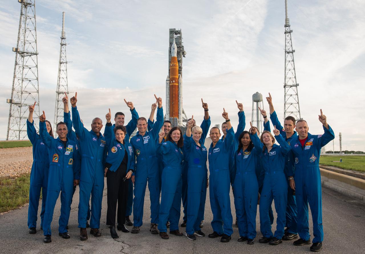Astronauts and astronaut candidates from NASA and the Canadian Space Agency pose for a photograph in front of NASA’s Artemis I Space Launch System and Orion spacecraft atop the mobile launcher on the pad at Launch Complex 39B on Aug. 28, 2022. The astronauts are, from left to right: Christina Birch, NASA astronaut candidate; Joe Acaba, NASA astronaut; Don Pettit, NASA astronaut; Victor Glover, NASA astronaut; Jeremy Hansen, Canadian Space Agency astronaut; Jessica Meir, NASA astronaut; Stan Love, NASA astronaut; Jack Hathaway, NASA astronaut candidate; Shannon Walker, NASA astronaut; Andre Douglas, NASA astronaut candidate; Kate Rubins, NASA astronaut; Chris Williams, NASA astronaut candidate; Reid Wiseman, NASA astronaut; Stephanie Wilson, NASA astronaut; Jessica Wittner, NASA astronaut candidate; Zena Cardman, NASA astronaut; Joshua Kutryk, Canadian Space Agency astronaut; Randy Bresnik, NASA astronaut. Artemis I is scheduled to launch Aug. 29, at 8:33 a.m. EDT. The first in a series of increasingly complex missions, Artemis I will provide a foundation for human deep space exploration and demonstrate our commitment and capability to extend human presence to the Moon and beyond. The primary goal of Artemis I is to thoroughly test the integrated systems before crewed missions by operating the spacecraft in a deep space environment, testing Orion’s heat shield, and recovering the crew module after reentry, descent, and splashdown.