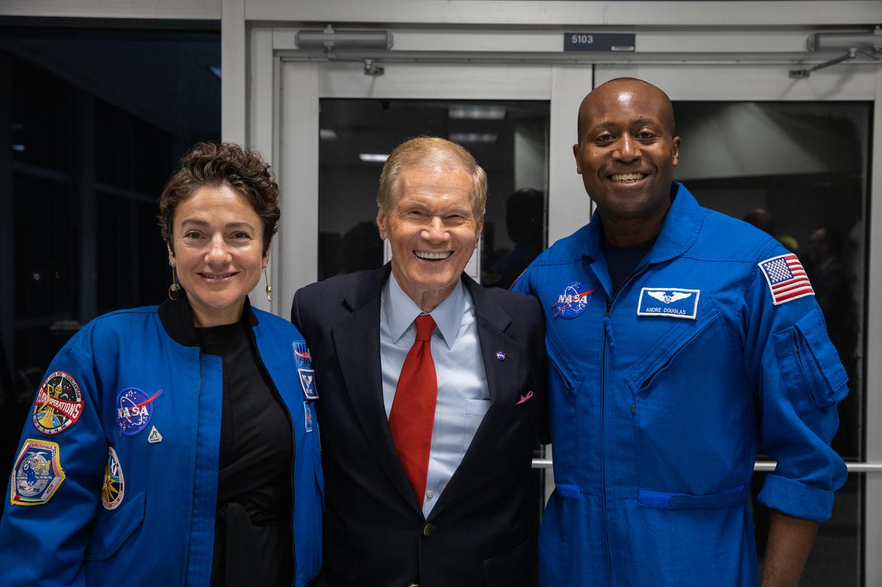 NASA Administrator Bill Nelson, center, visits with NASA astronaut Jessica Meir, at right, and astronaut candidate Andre Douglas, during launch countdown activities for NASA’s Artemis I mission on Aug. 29, 2022, at the agency’s Kennedy Space Center in Florida. The launch was waved off for the day. The first in a series of increasingly complex missions, Artemis I will provide a foundation for human deep space exploration and demonstrate our commitment and capability to extend human presence to the Moon and beyond. The primary goal of Artemis I is to thoroughly test the integrated systems before crewed missions by operating the spacecraft in a deep space environment, testing Orion’s heat shield, and recovering the crew module after reentry, descent, and splashdown.