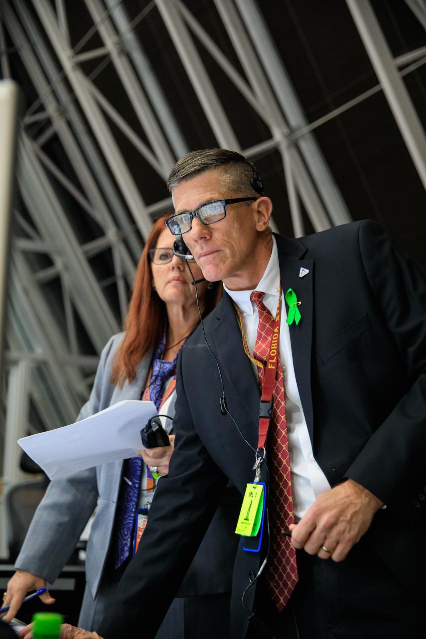 From left, Artemis I Launch Director Charlie Blackwell-Thompson, and Assistant Launch Director Jeremy Graeber,  monitor launch countdown events inside Firing Room 1 of the Rocco A. Petrone Launch Control Center at NASA’s Kennedy Space Center in Florida on Aug. 29, 2022. Launch of the agency’s Space Launch System and Orion spacecraft was waved off due to an issue during tanking. Launch is now no earlier than Sept. 3, at 2:17 p.m. EDT from Kennedy’s Launch Complex 39B. The first in a series of increasingly complex missions, Artemis I will provide a foundation for human deep space exploration and demonstrate our commitment and capability to extend human presence to the Moon and beyond. The primary goal of Artemis I is to thoroughly test the integrated systems before crewed missions by operating the spacecraft in a deep space environment, testing Orion’s heat shield, and recovering the crew module after reentry, descent, and splashdown.