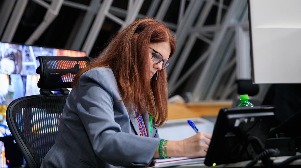 Artemis I Launch Director Charlie Blackwell-Thompson works at her console during launch countdown inside Firing Room 1 of the Rocco A. Petrone Launch Control Center at NASA’s Kennedy Space Center in Florida on  Aug. 29, 2022. Launch of the agency’s Space Launch System and Orion spacecraft was waved off due to an issue during tanking. Launch is now no earlier than Sept. 3, at 2:17 p.m. EDT from Kennedy’s Launch Complex 39B. The first in a series of increasingly complex missions, Artemis I will provide a foundation for human deep space exploration and demonstrate our commitment and capability to extend human presence to the Moon and beyond. The primary goal of Artemis I is to thoroughly test the integrated systems before crewed missions by operating the spacecraft in a deep space environment, testing Orion’s heat shield, and recovering the crew module after reentry, descent, and splashdown. 