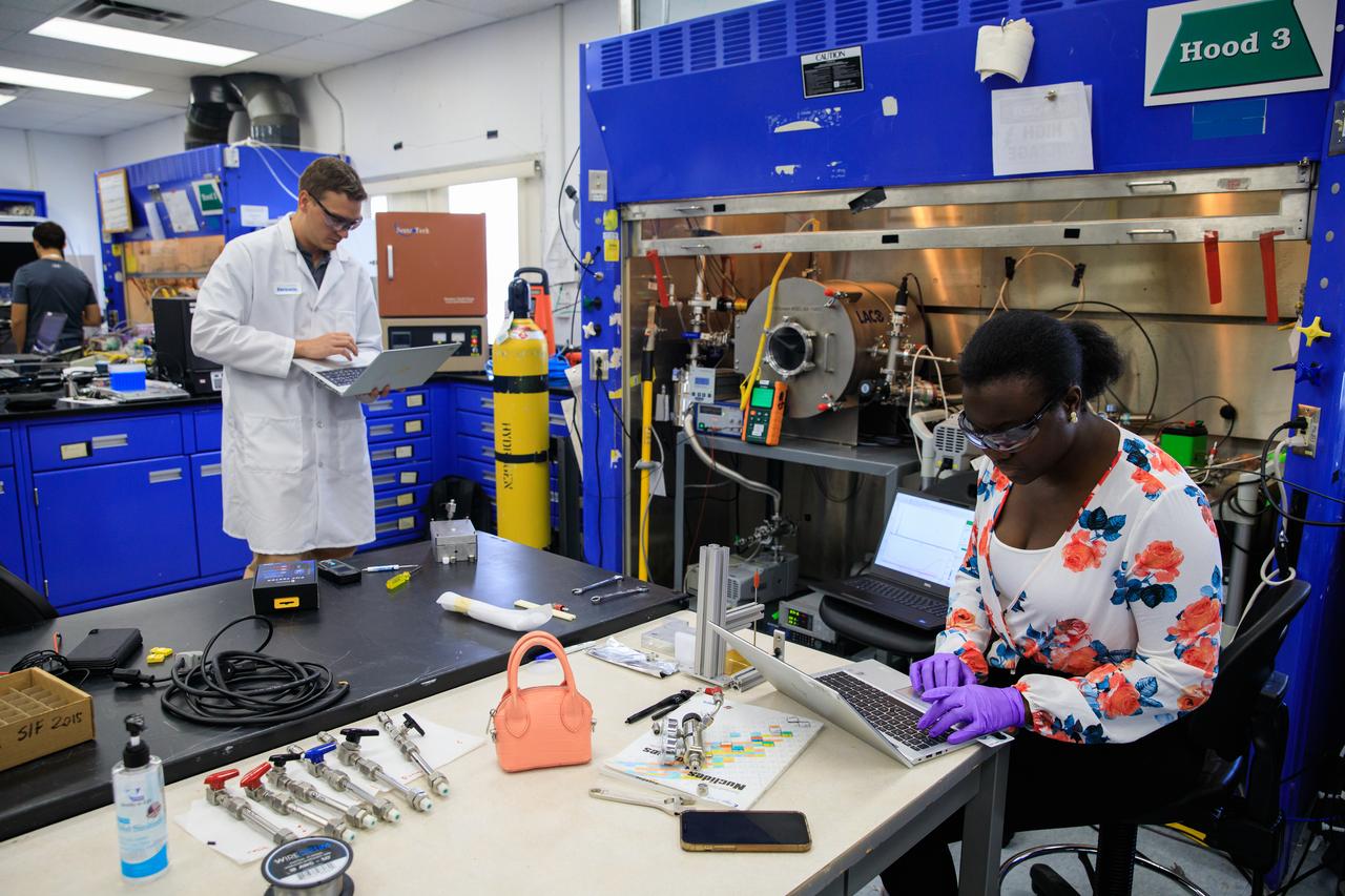 Engineers conduct testing of the Molten Regolith Electrolysis (MRE) inside a laboratory in the Neil A. Armstrong Operations and Checkout Building at NASA’s Kennedy Space Center in Florida on Aug. 30, 2022.  This is a high-temperature electrolytic process which aims to extract oxygen from the simulated lunar regolith. Extraction of oxygen on the lunar surface is critical to the agency’s Artemis program. Oxygen extracted from the Moon can be utilized for propellent to NASA’s lunar landers., breathable oxygen for astronauts, and a variety of other industrial and scientific applications for NASA’s future missions to the Moon.