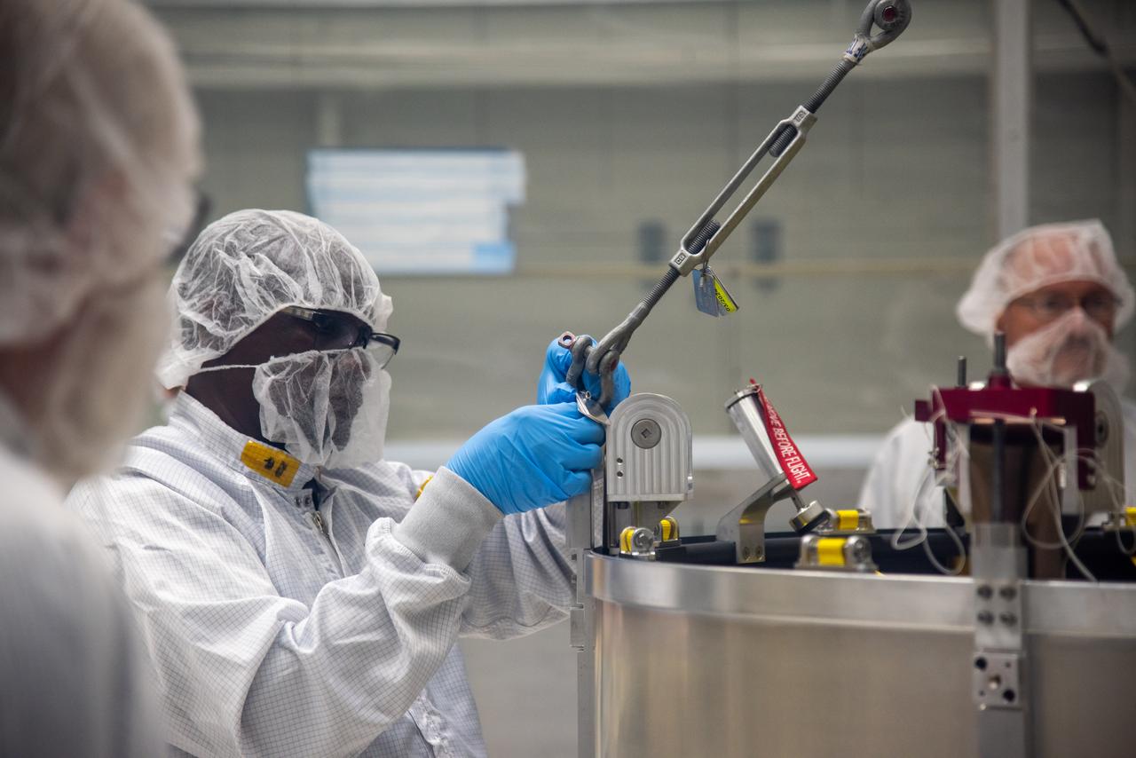 Technicians prepare to lift the Low-Earth Orbit Flight Test of an Inflatable Decelerator (LOFTID) payload adapter separation systems canister, where it will go inside the payload adapter canister as part of launch preparations occurring inside Building 836 at Vandenberg Space Force Base (VSFB) in California on Sept. 1, 2022. LOFTID is the secondary payload on NASA and the National Oceanic and Atmospheric Administration’s (NOAA) Joint Polar Satellite System-2 (JPSS-2) satellite mission. JPSS-2 is the third satellite in the Joint Polar Satellite System series. It is scheduled to lift off from VSFB on Nov. 1 from Space Launch Complex-3. JPSS-2, which will be renamed NOAA-21 after reaching orbit, will join a constellation of JPSS satellites that orbit from the North to the South pole, circling Earth 14 times a day and providing a full view of the entire globe twice daily. 